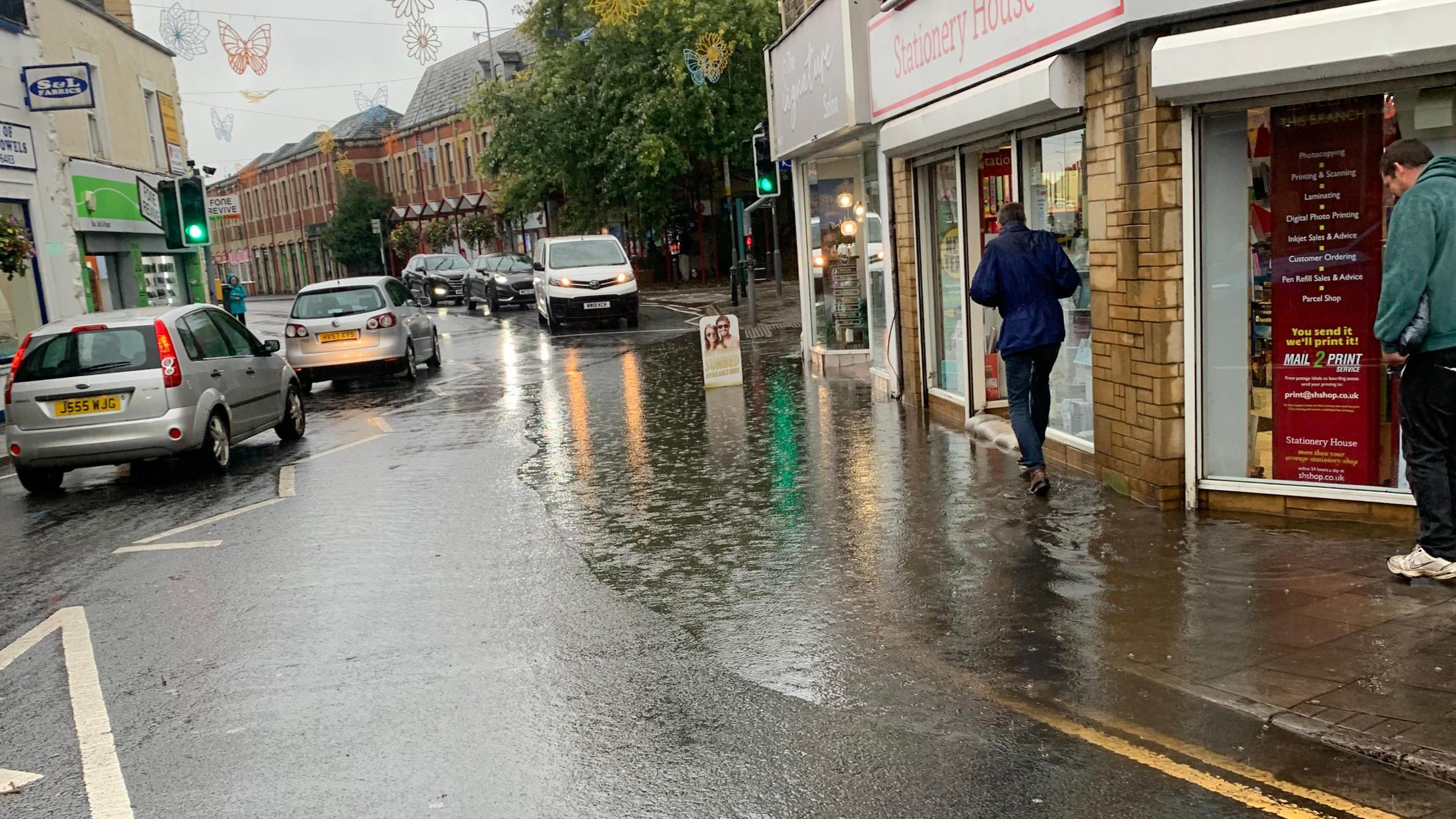 A pavement that is completely underwater due to the heavy flooding