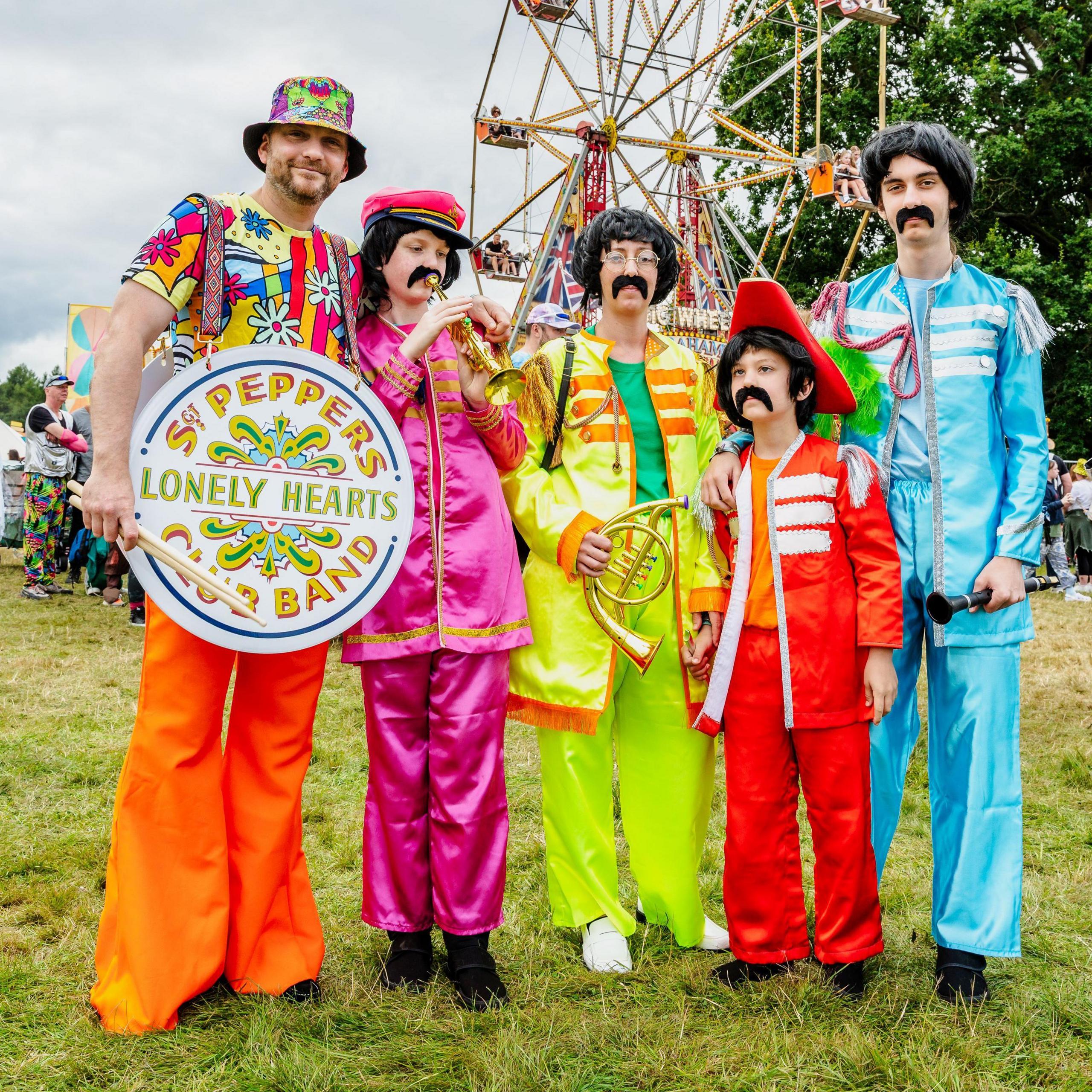 Five people dressed up as members of Sgt Pepper's Lonely Hearts Club Band