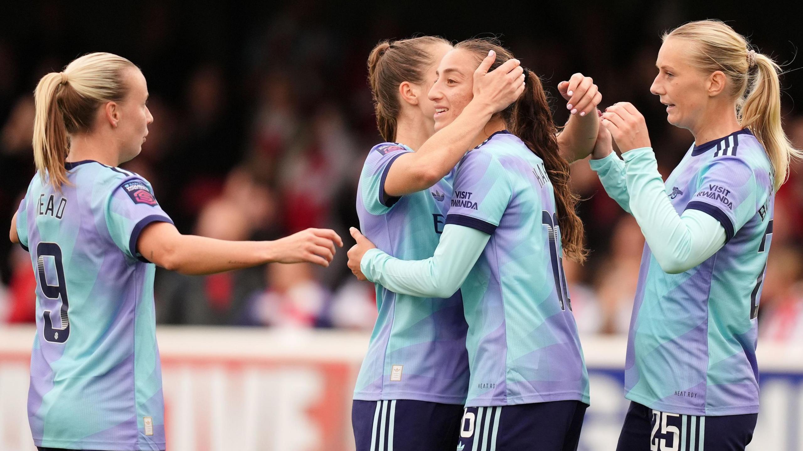 Rosa Kafaji (centre right) celebrates making it 2-0 to Arsenal