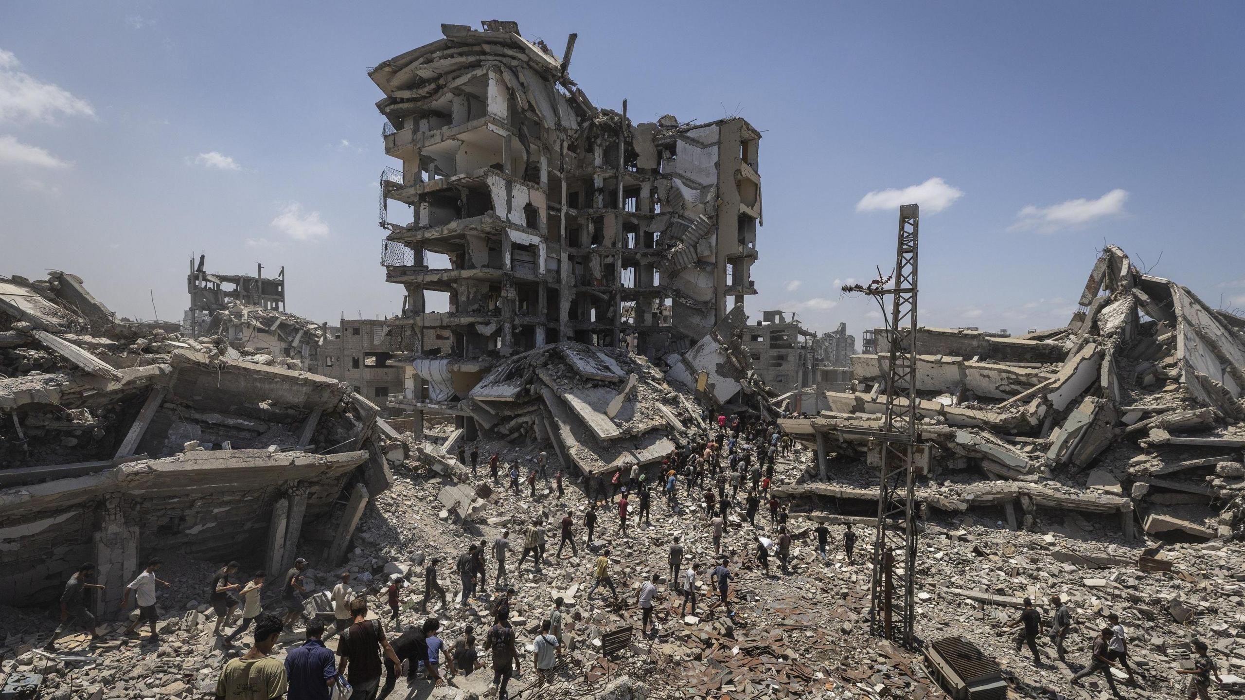 Planes drop aid packages by parachute amid Israeli attacks as the Palestinians flock to the area where the humanitarian aid packages land over western Gaza City, Gaza on August 7, 2025. 