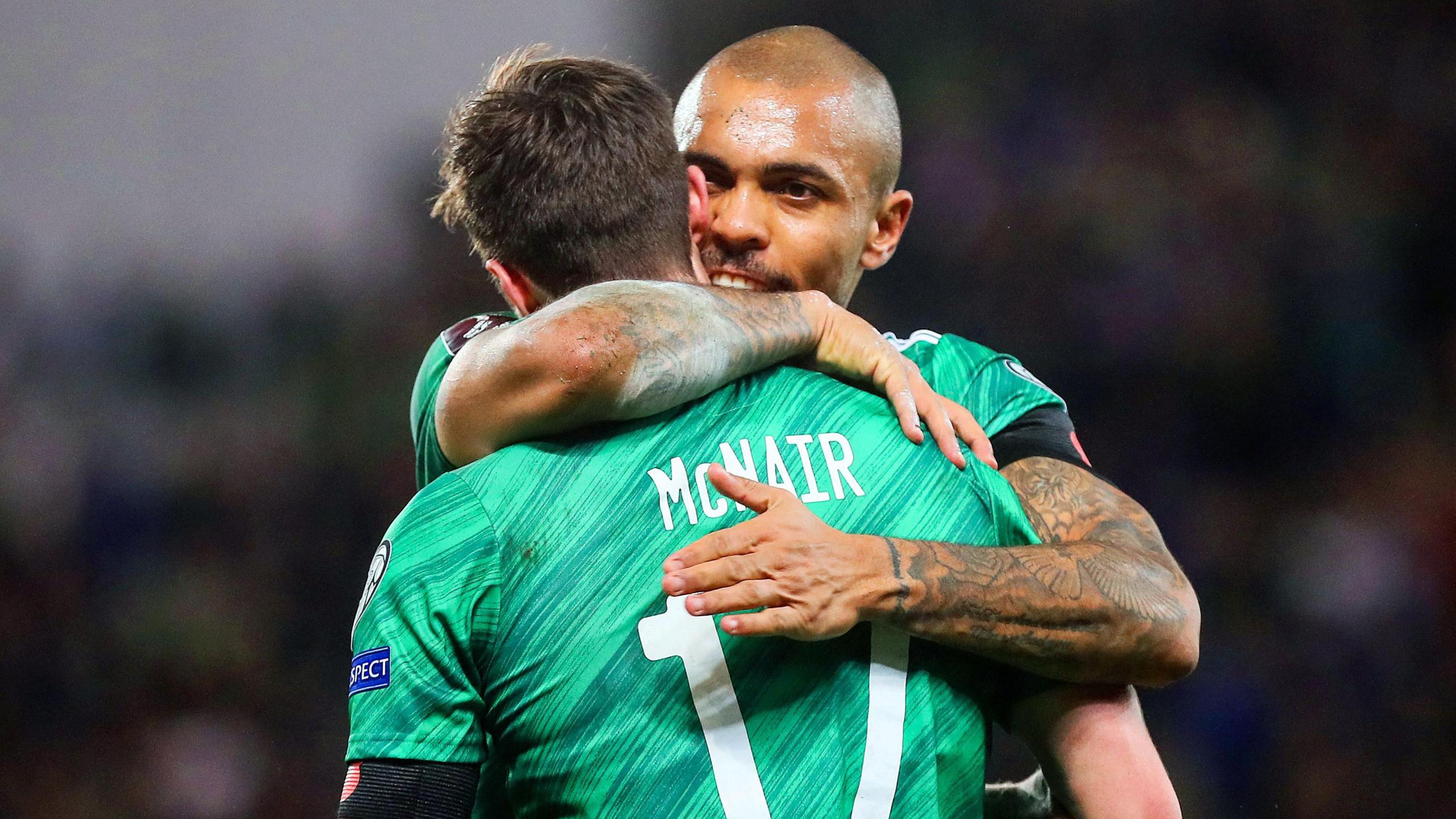 Paddy McNair hugs Josh Magennis 