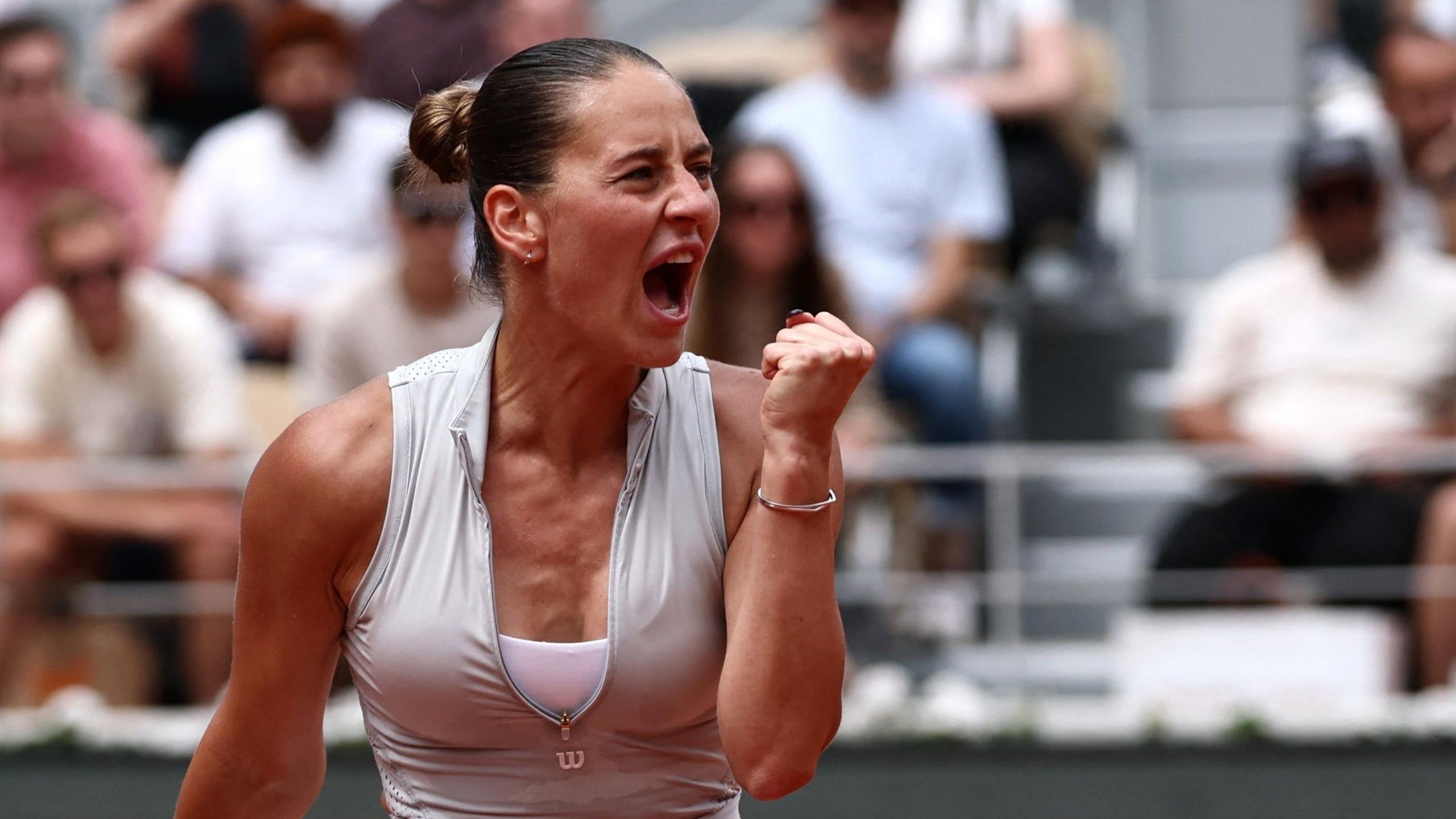 Marta Kostyuk fist-pumps in celebration