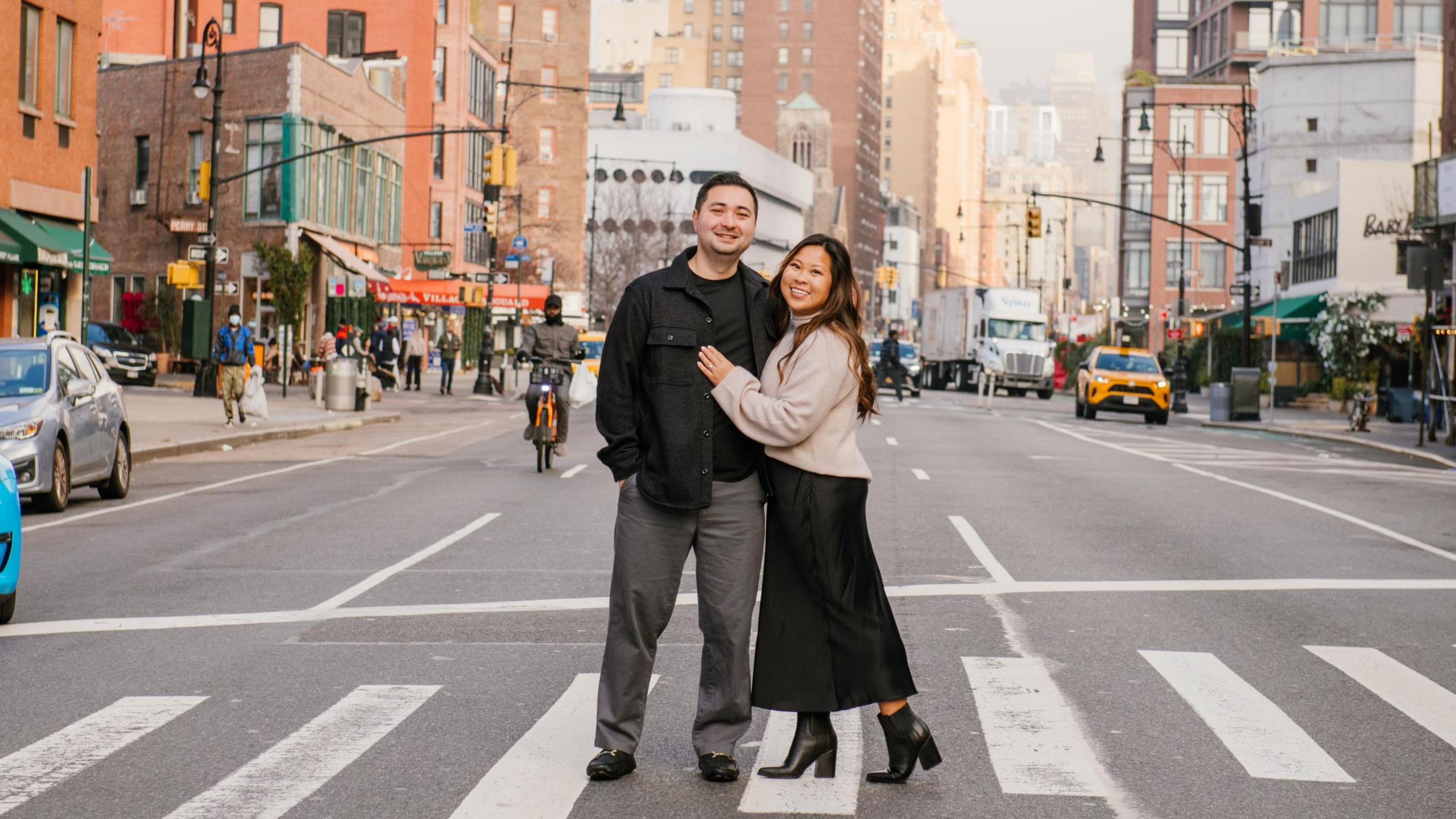 Mimi Than and her husband on a busy street