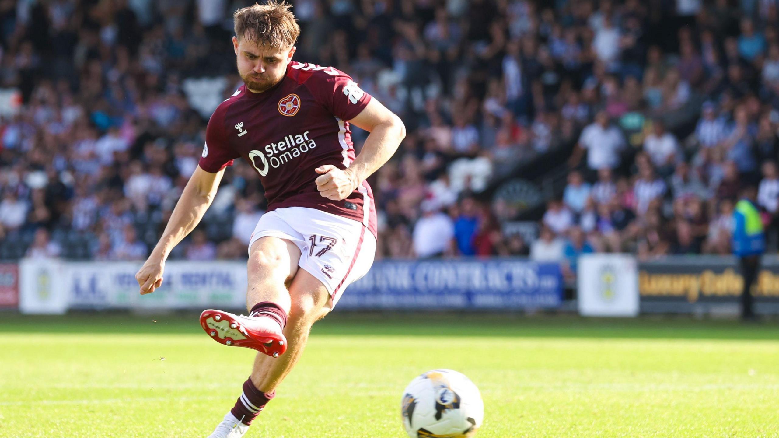 Alan Forrest scoring a penalty for Hearts