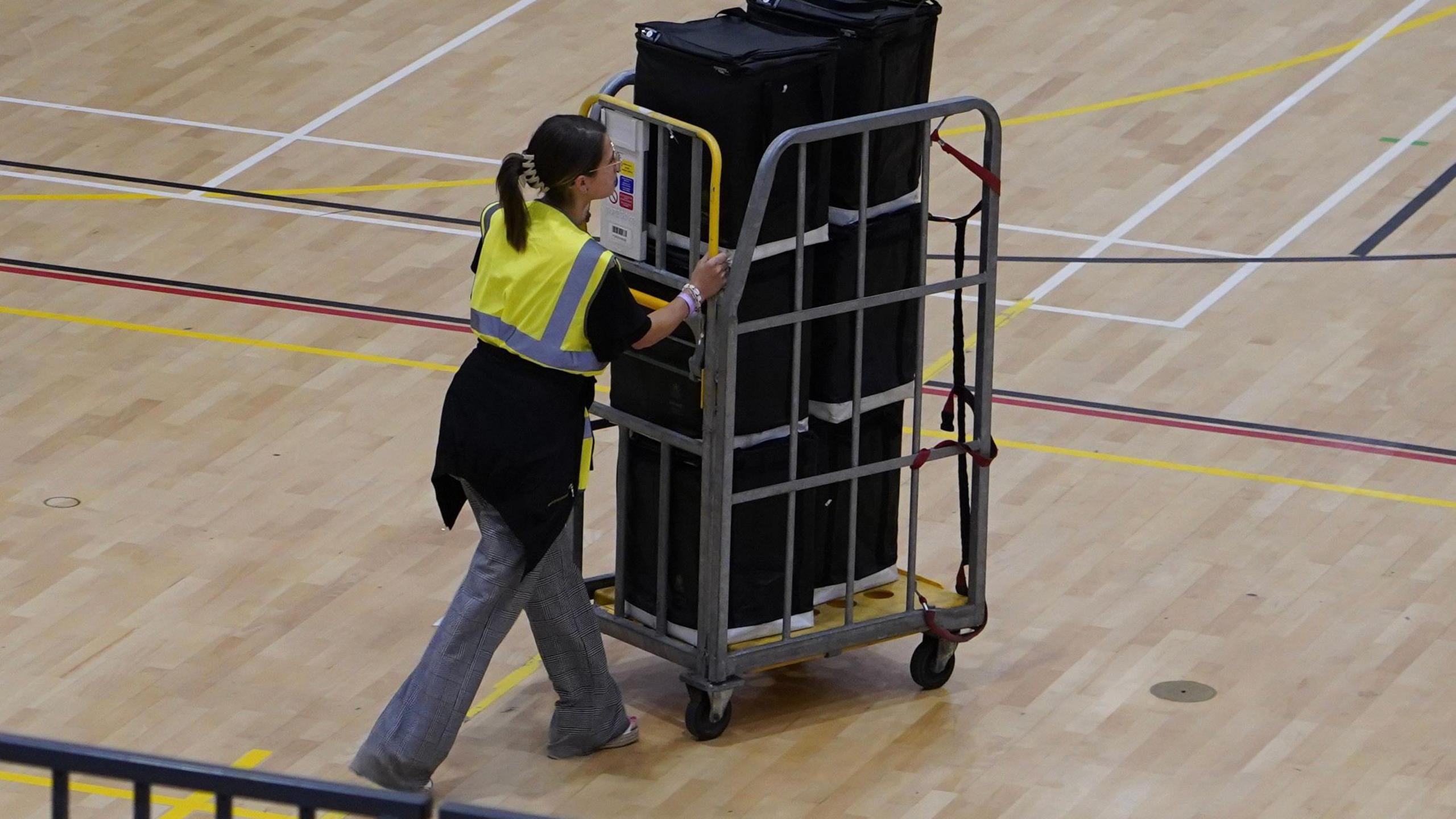 A trolley full of black boxes