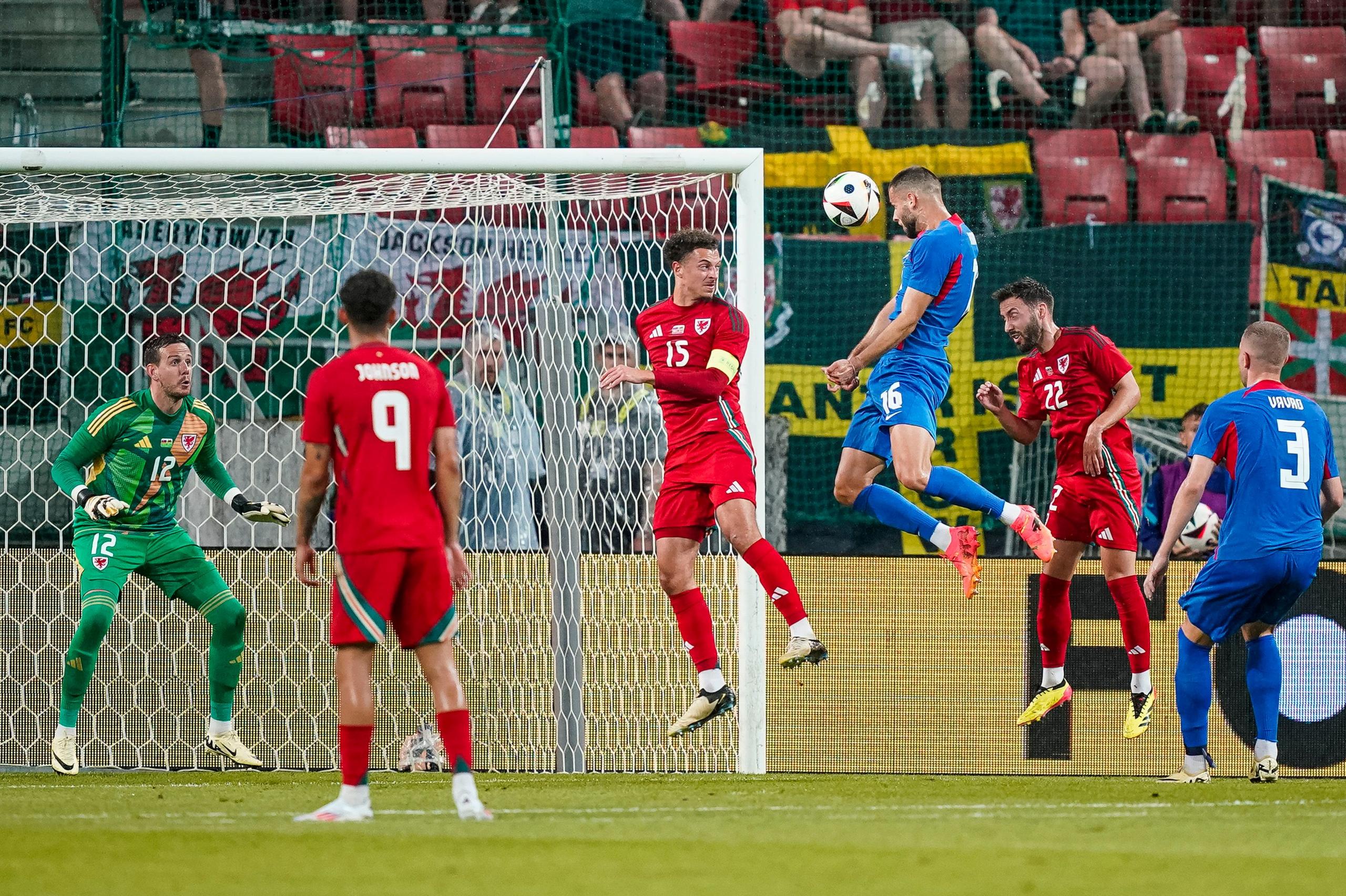  Ethan Ampadu of Wales defends against David Hancko of Slovakia