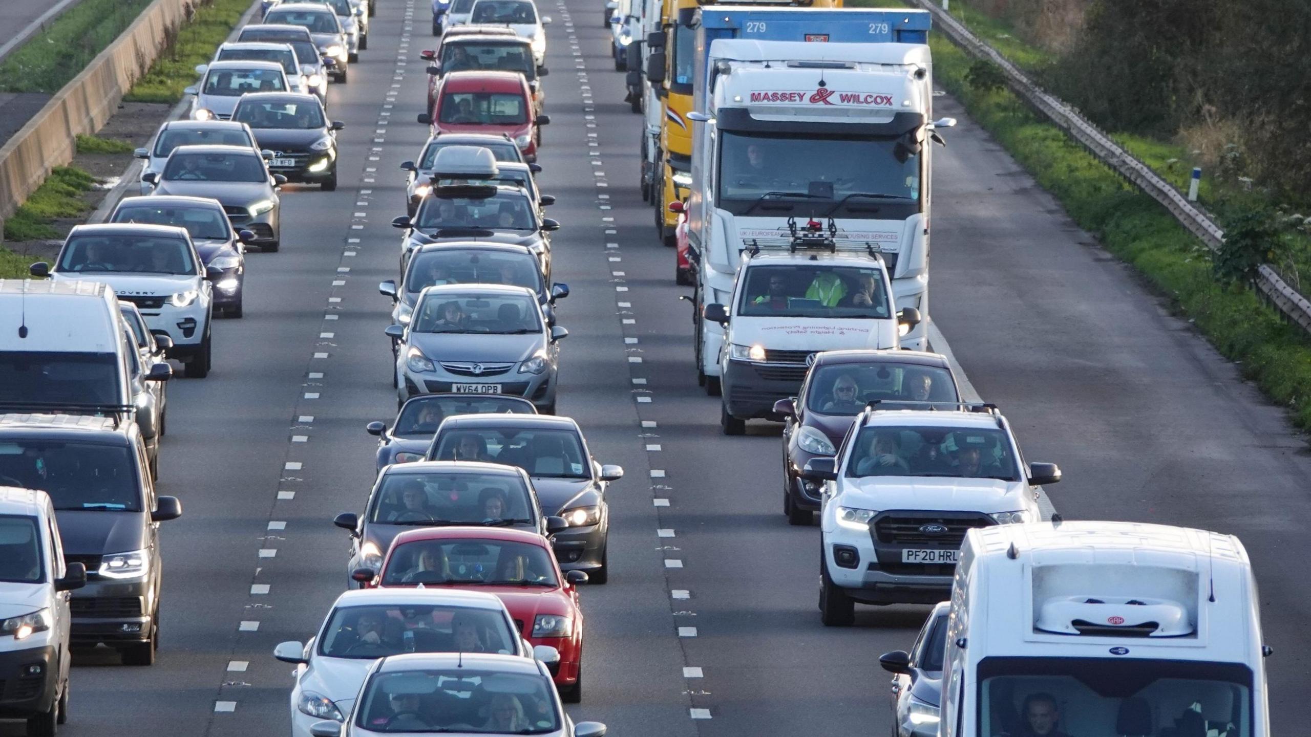 Vehicles queue in a traffic jam as rain on the M5 motorway on October 25, 2024 near Locking, England.