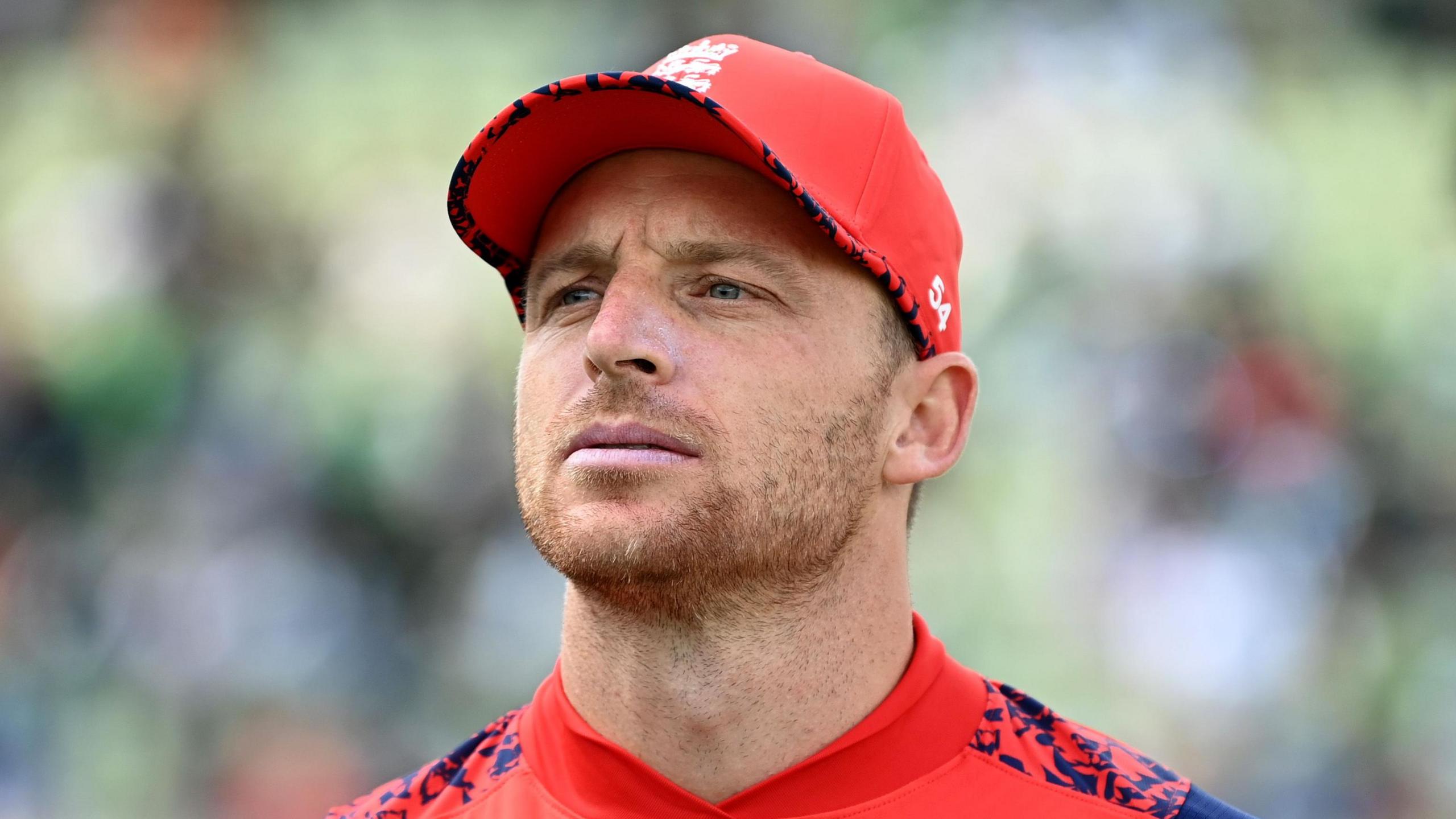 England captain Jos Buttler looks on