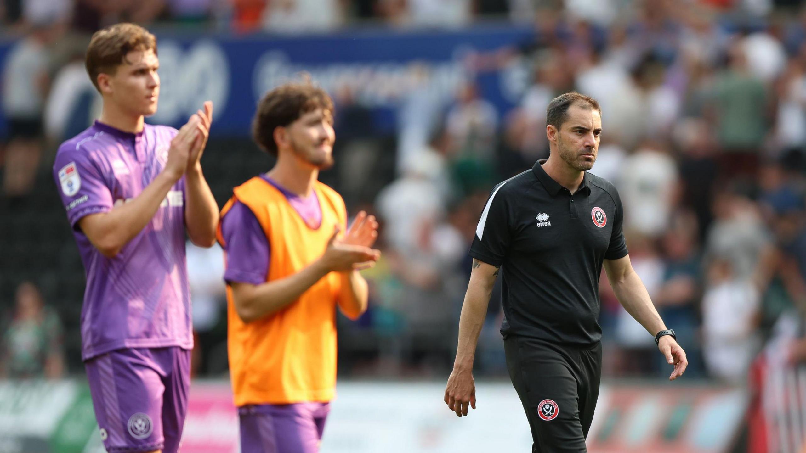 Sheffield United players and boss Ruben Selles go over to the fans after their loss at Swansea