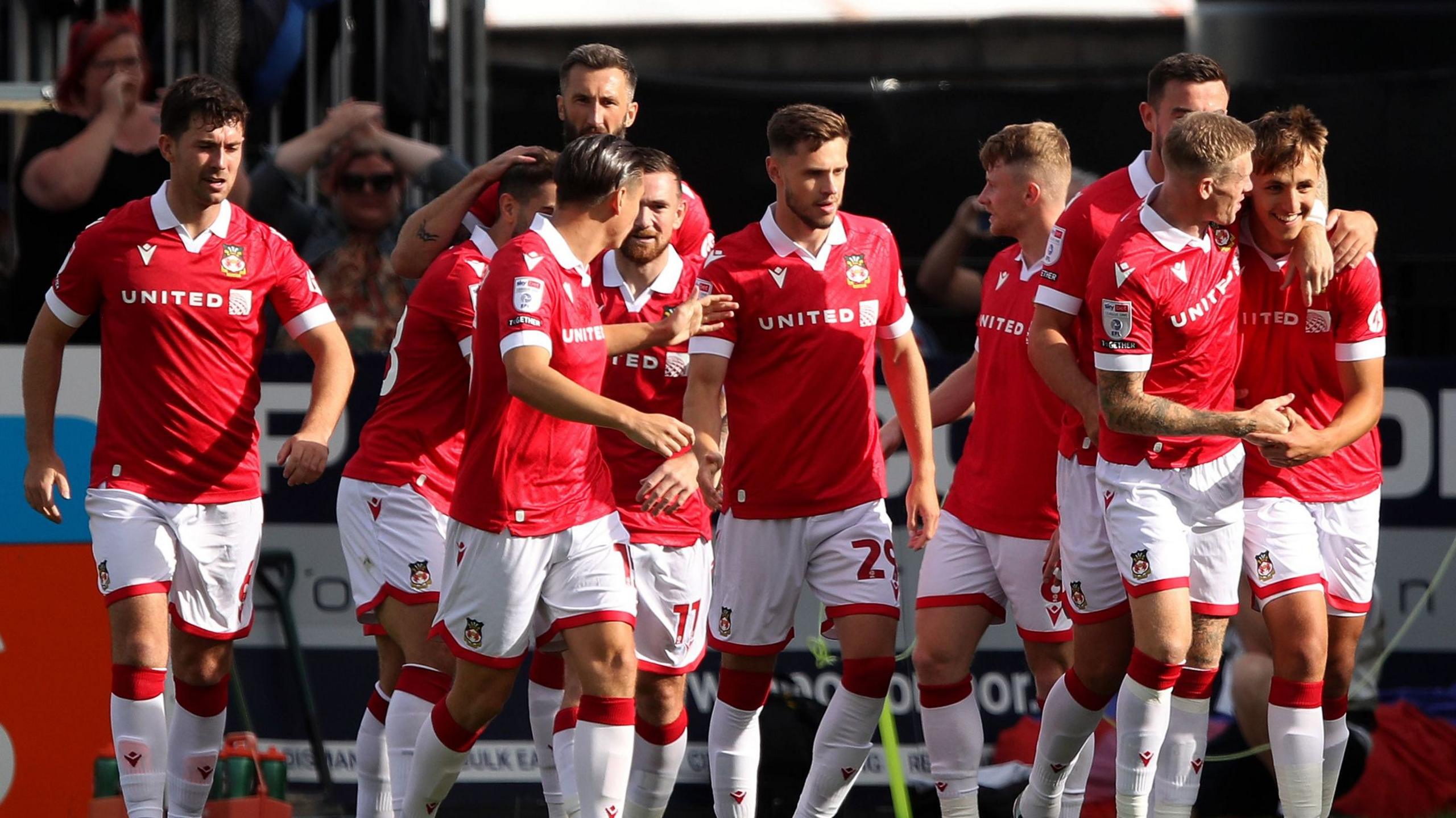 Wrexham's Max Cleworth celebrates scoring the first goal