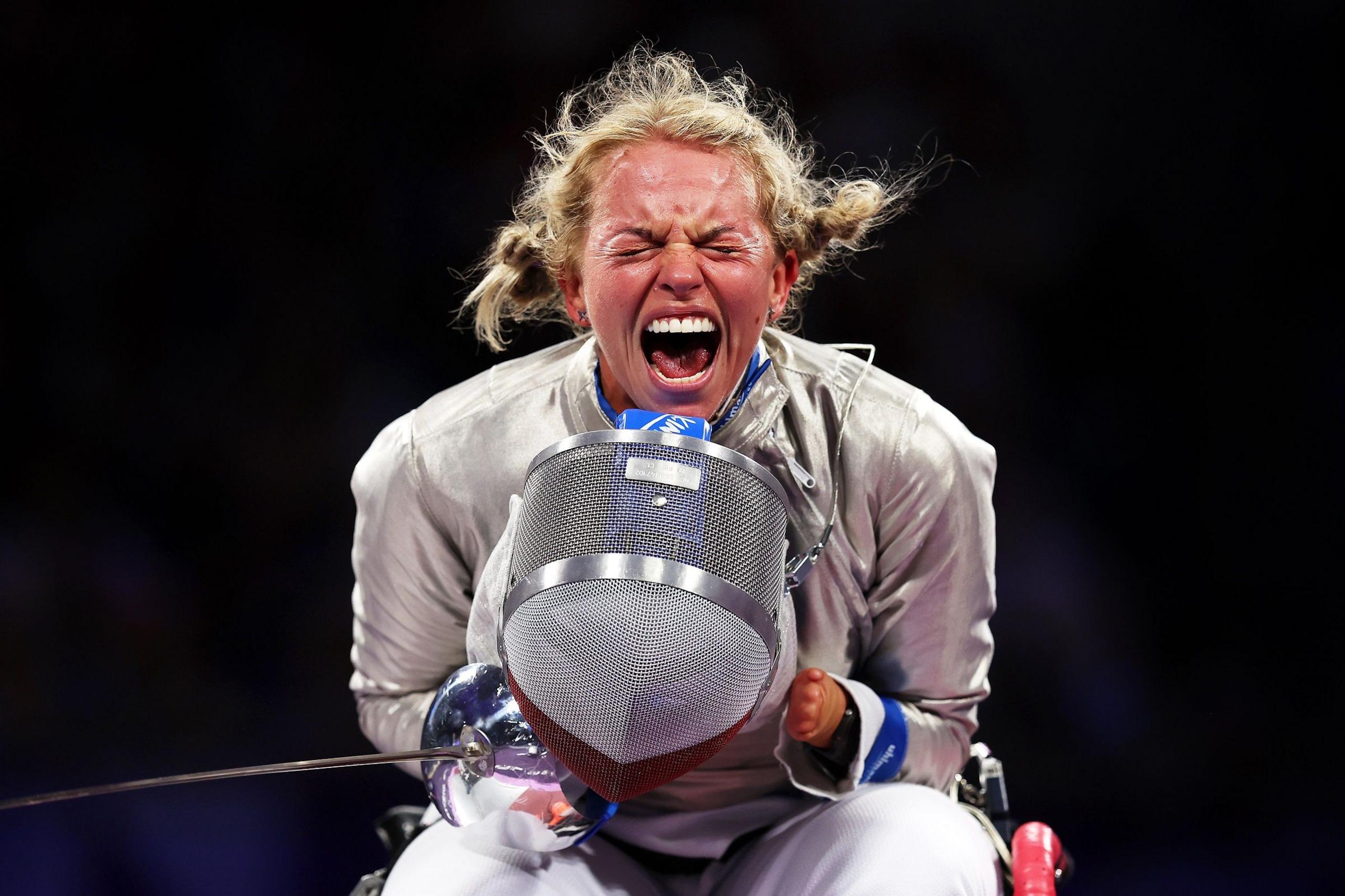 Polish wheelchair fencer Kinga Drozdz celebrates winning her women's sabre semi-final at the Paris 2024 Parlaympics