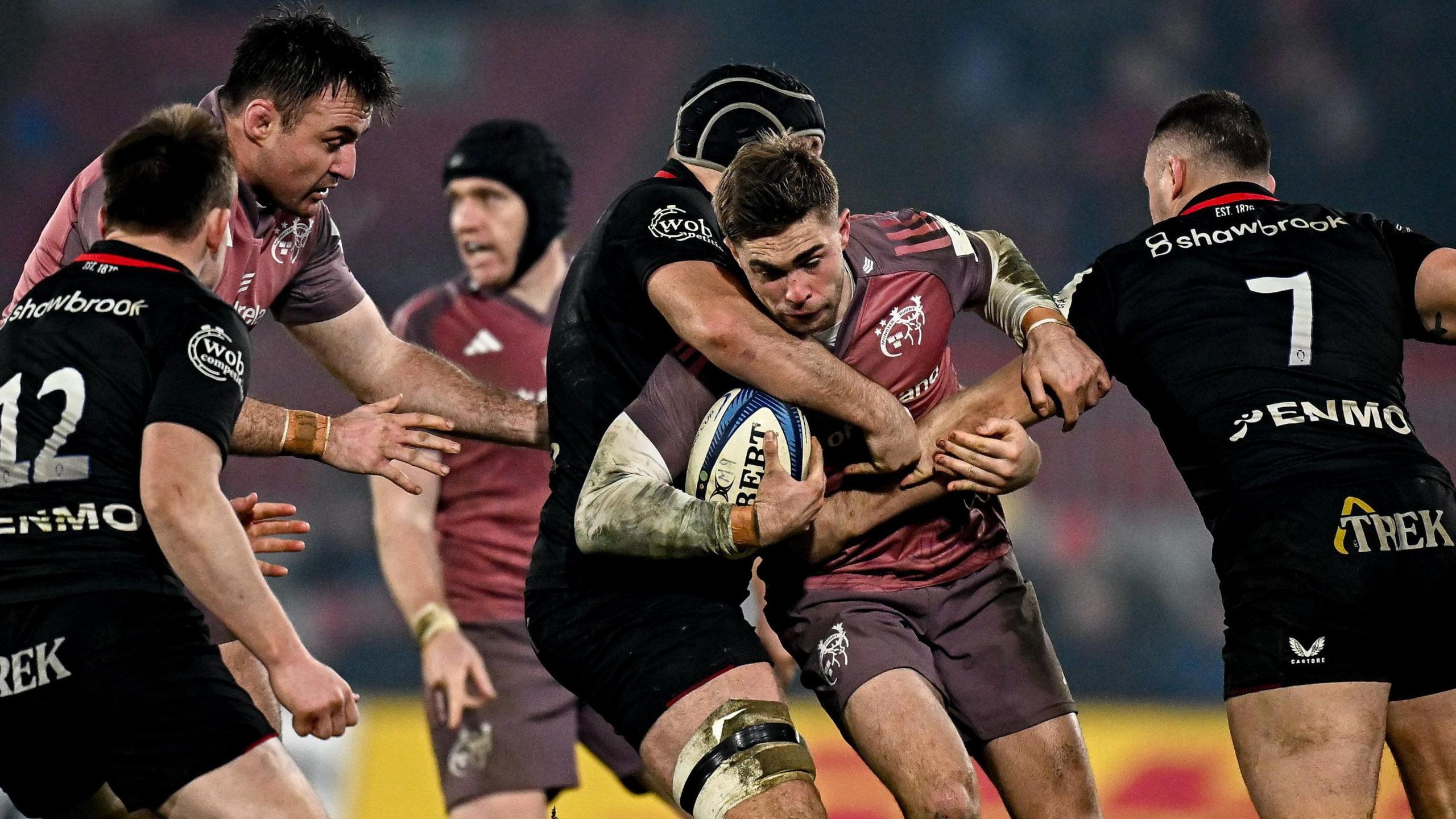 Jack Crowley is tackled by Saracens 