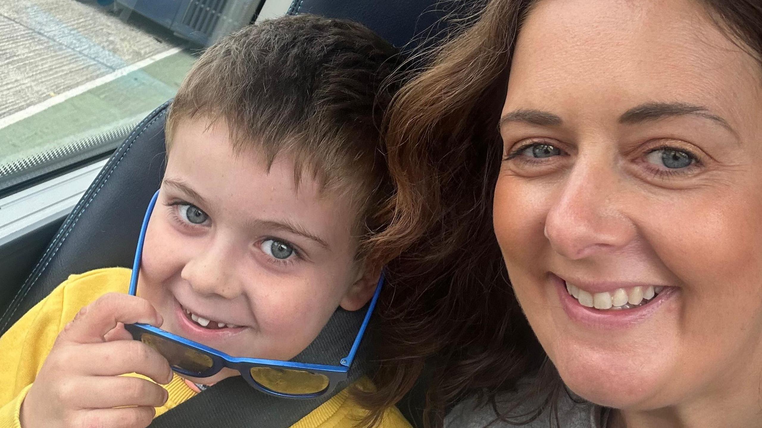 Emma Morgan and her son, he is wearing a yellow jumper they are both smiling