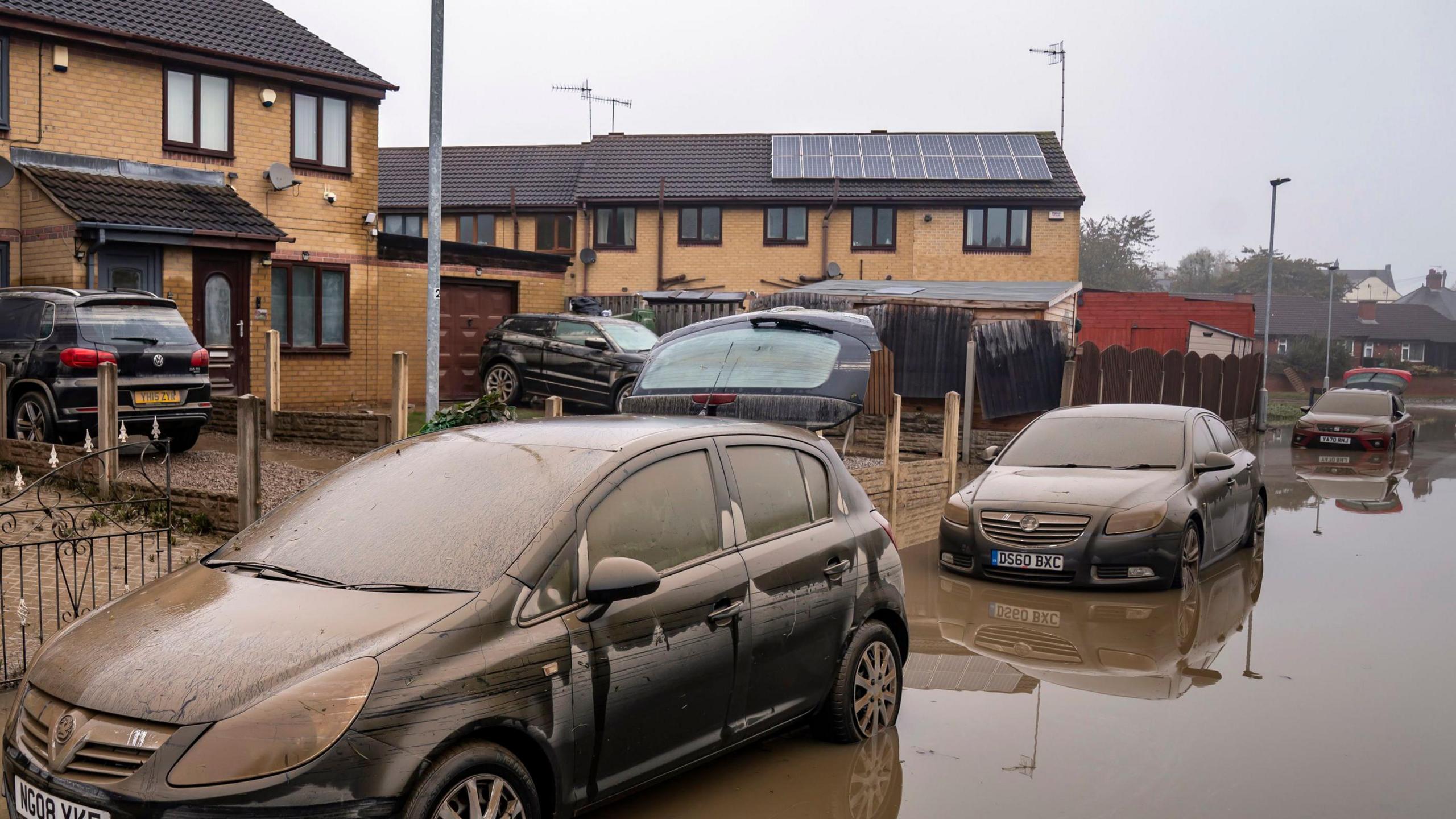 Cars submerged in floodwater in Catcliffe