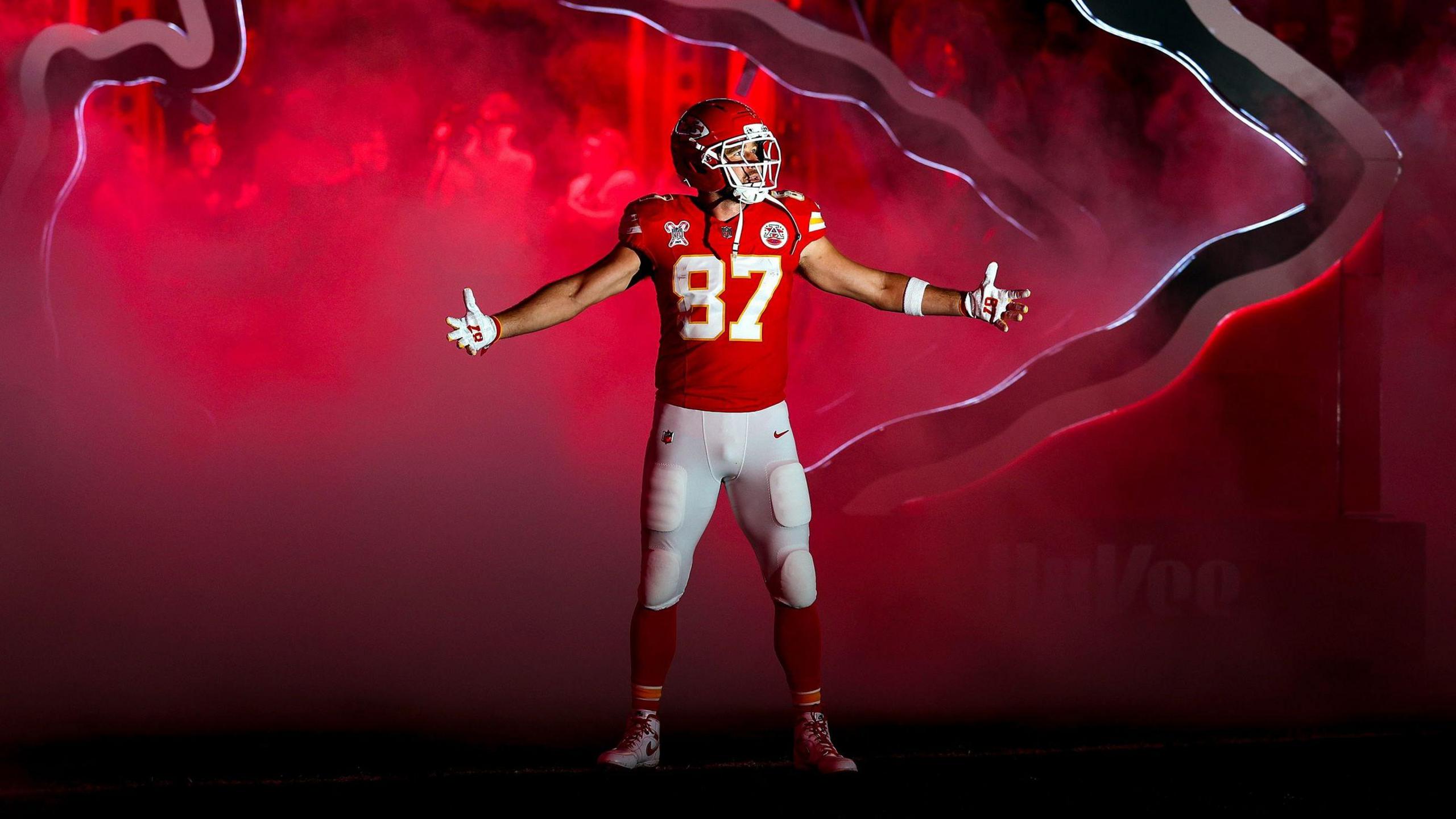 Travis Kelce makes his entrance onto the field at Arrowhead Stadium for the Kansas City Chiefs as they play the Denver Broncos in the NFL