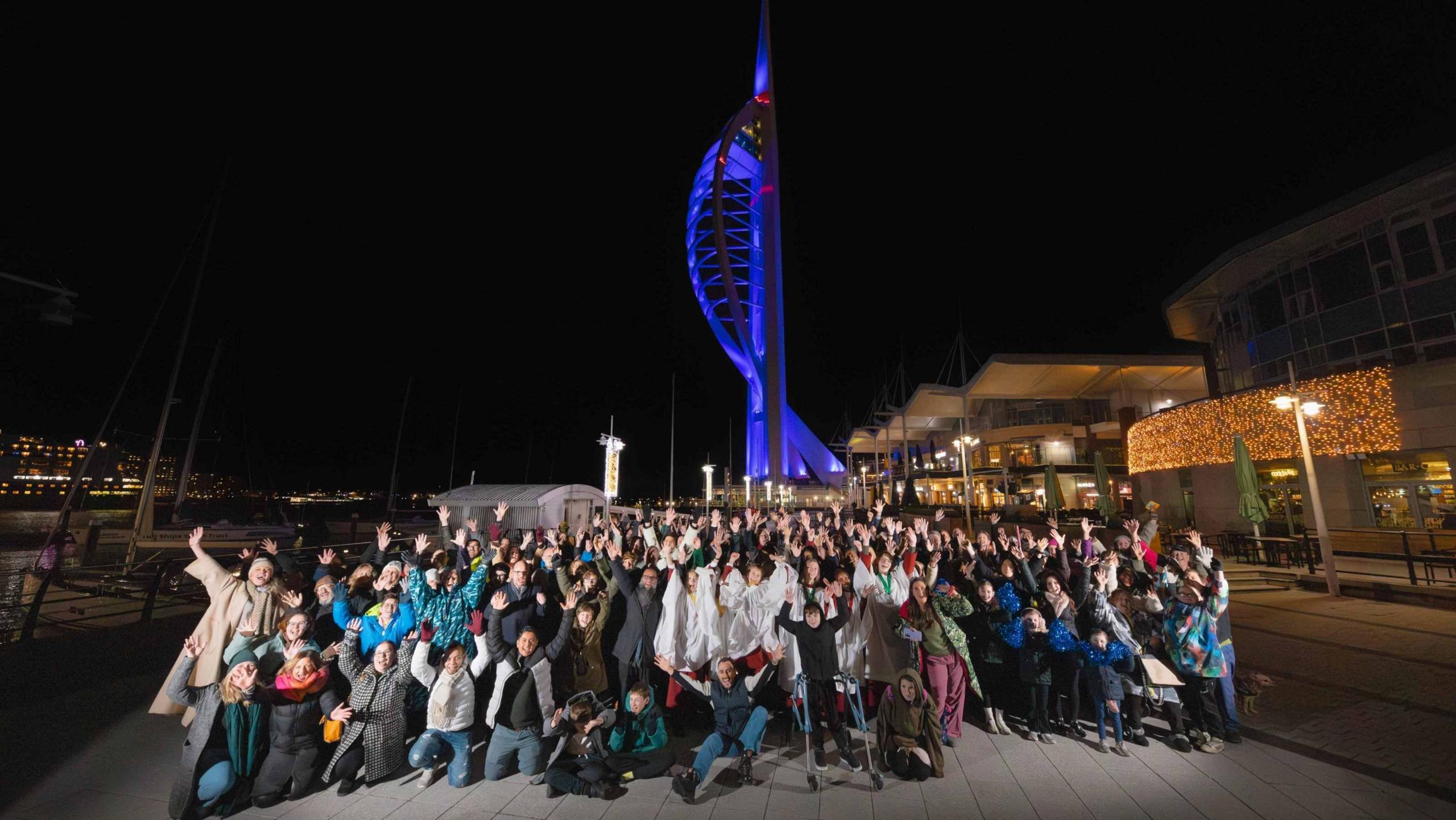 Image of a large group of people outside the spinnaker tower in Portsmouth