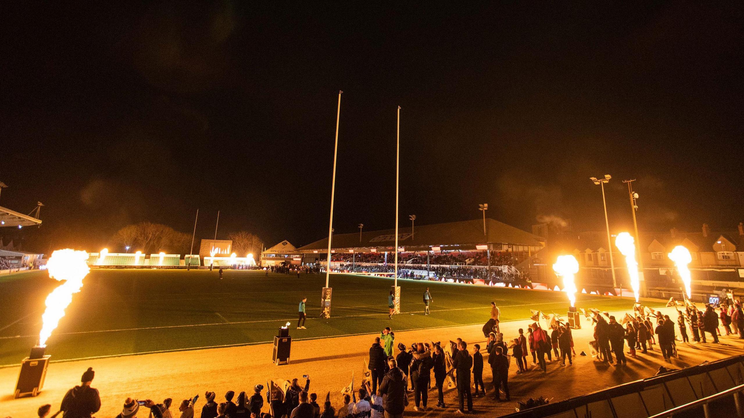 Rodney Parade before a Dragons game with flames next to the pitch