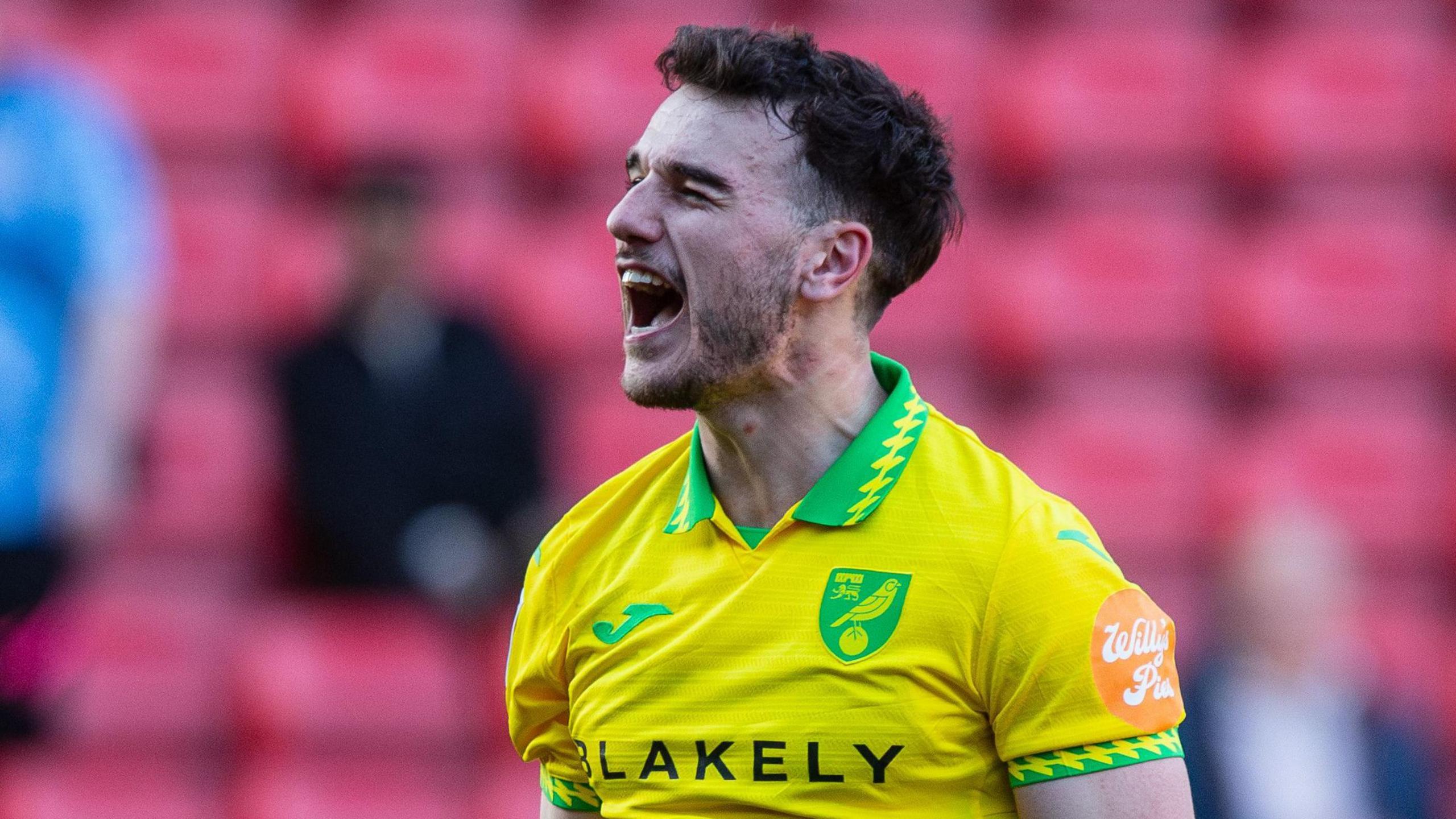 Liam Gibbs celebrates Norwich's win at Charlton Athletic on 21 March 