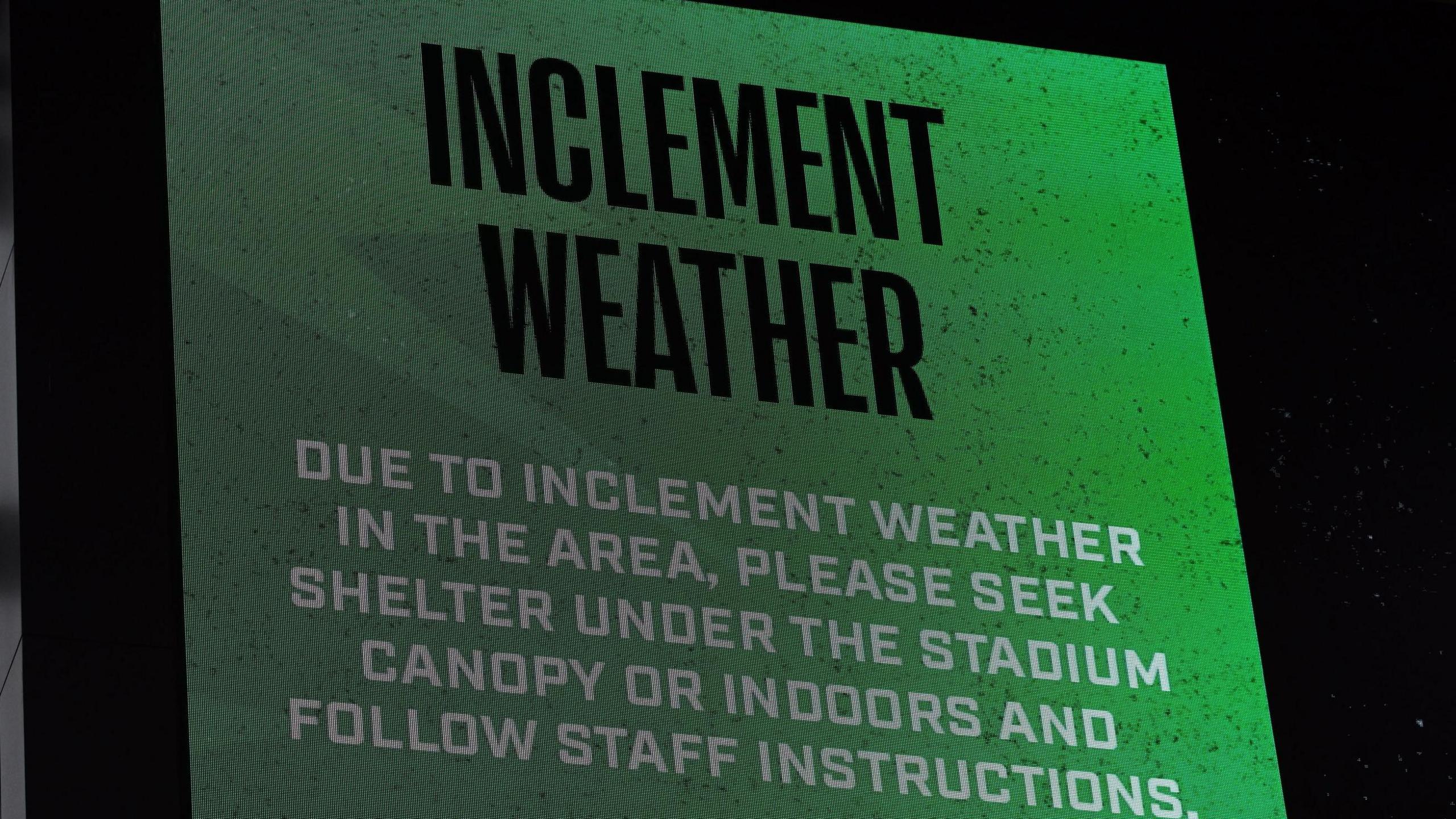 A message at the Q2 Stadium in Texas tells fans to seek shelter because of extreme weather