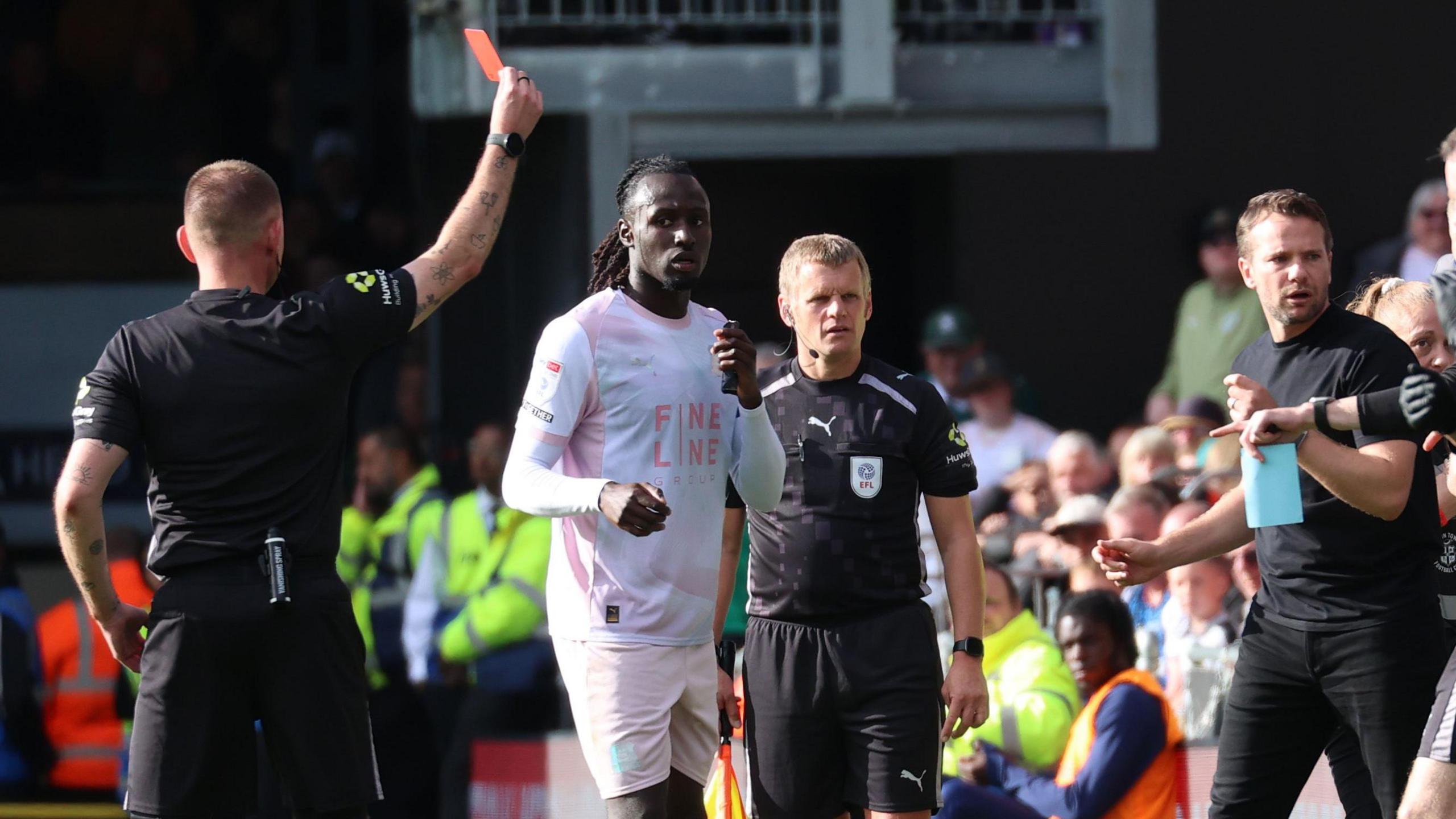 Tom Cleverley (right) is sent off during the second half of the 3-2 win at Luton Town