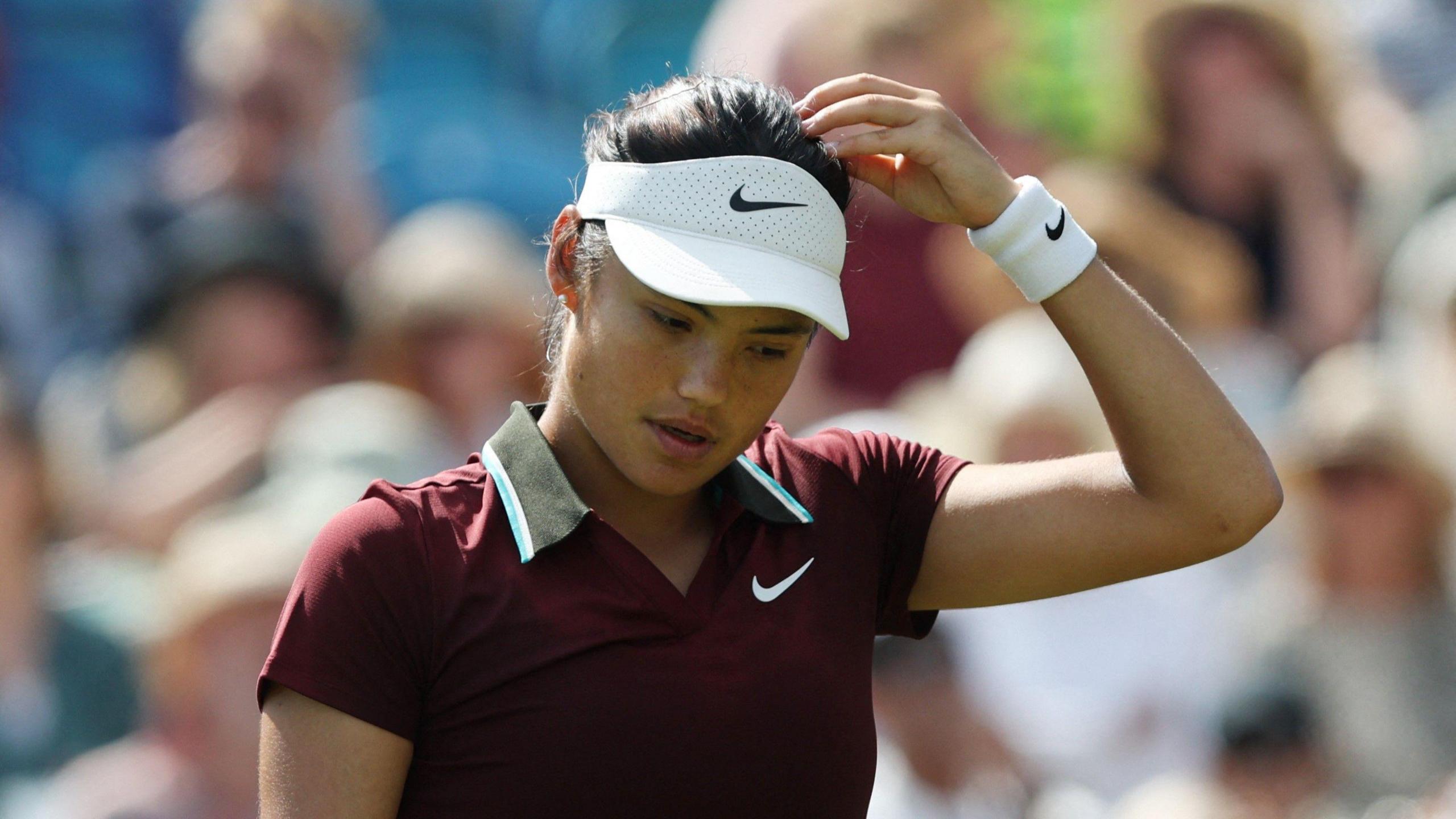 Emma Raducanu reacts in disappointment after defeat by Eastbourne