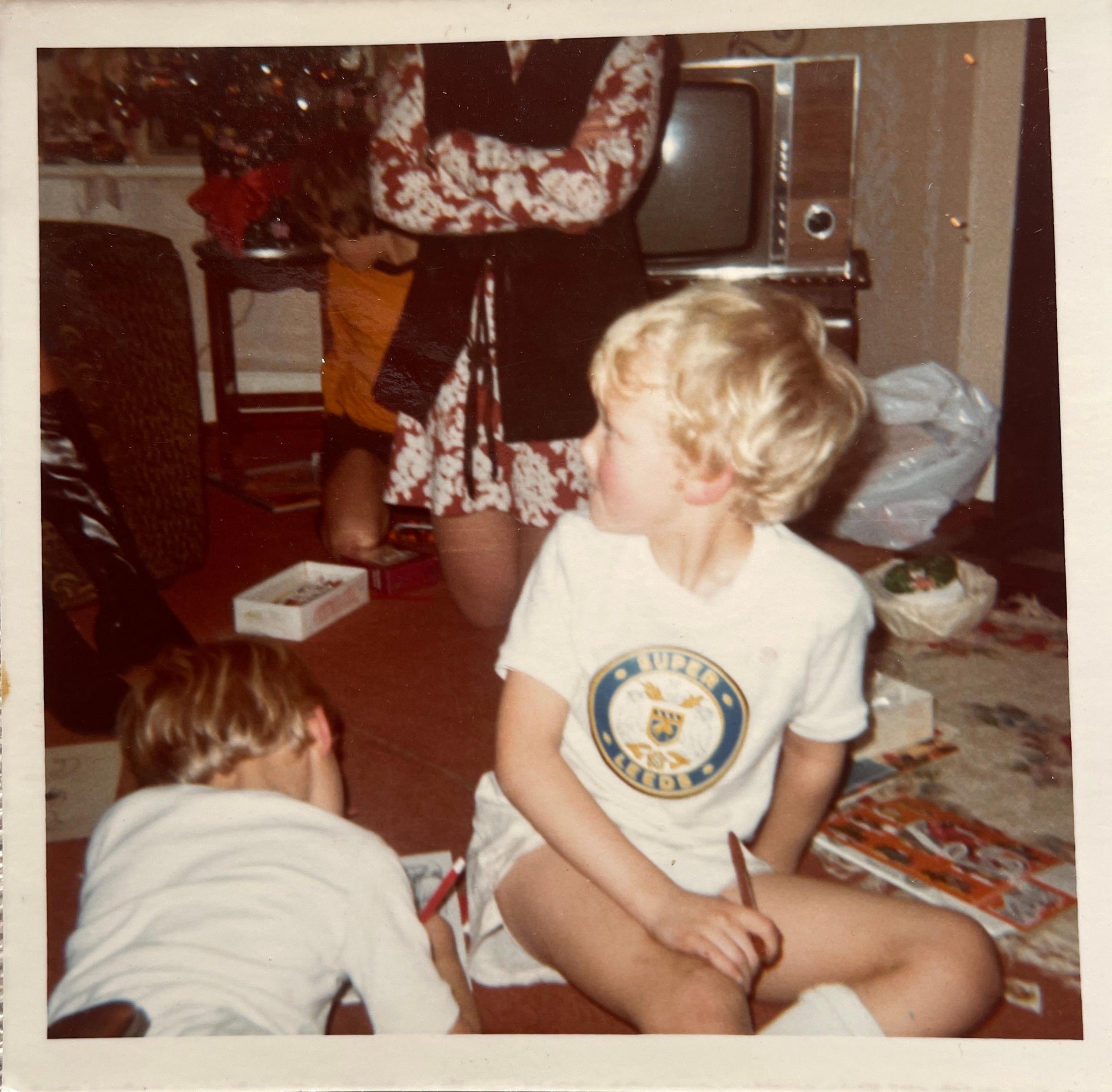 Young Leeds United fan in a Leeds shirt.
