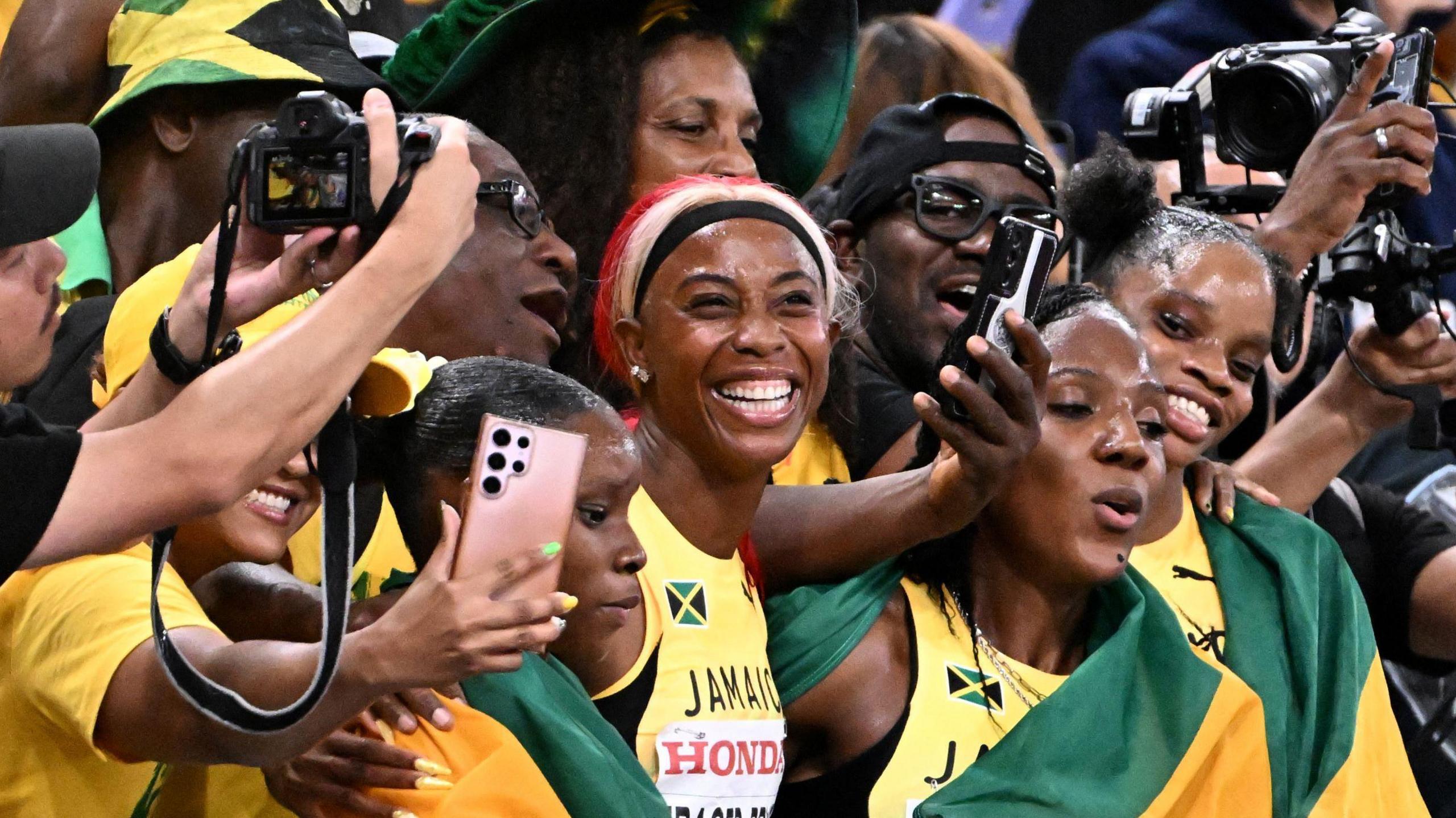 Jamaica's Shelly-Ann Fraser-Pryce smiles after competing at the World Athletics Championships in Tokyo