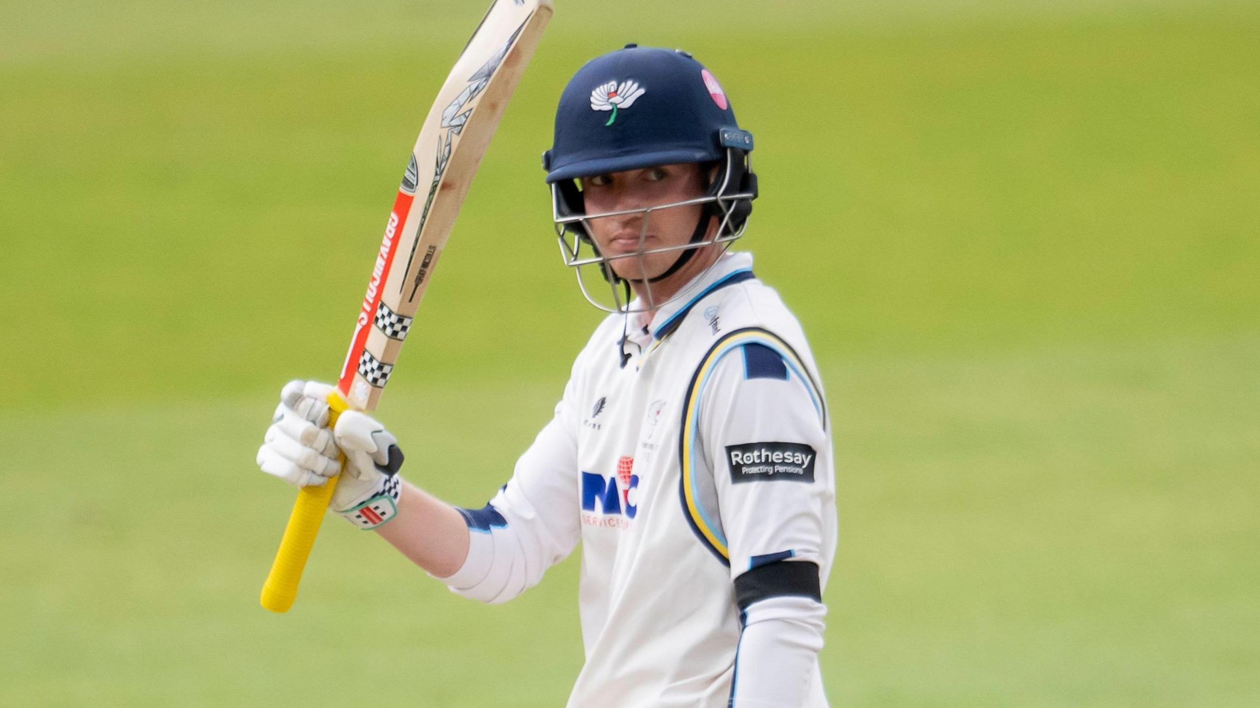 George Hill raises hit bat after reaching 50 for Yorkshire
