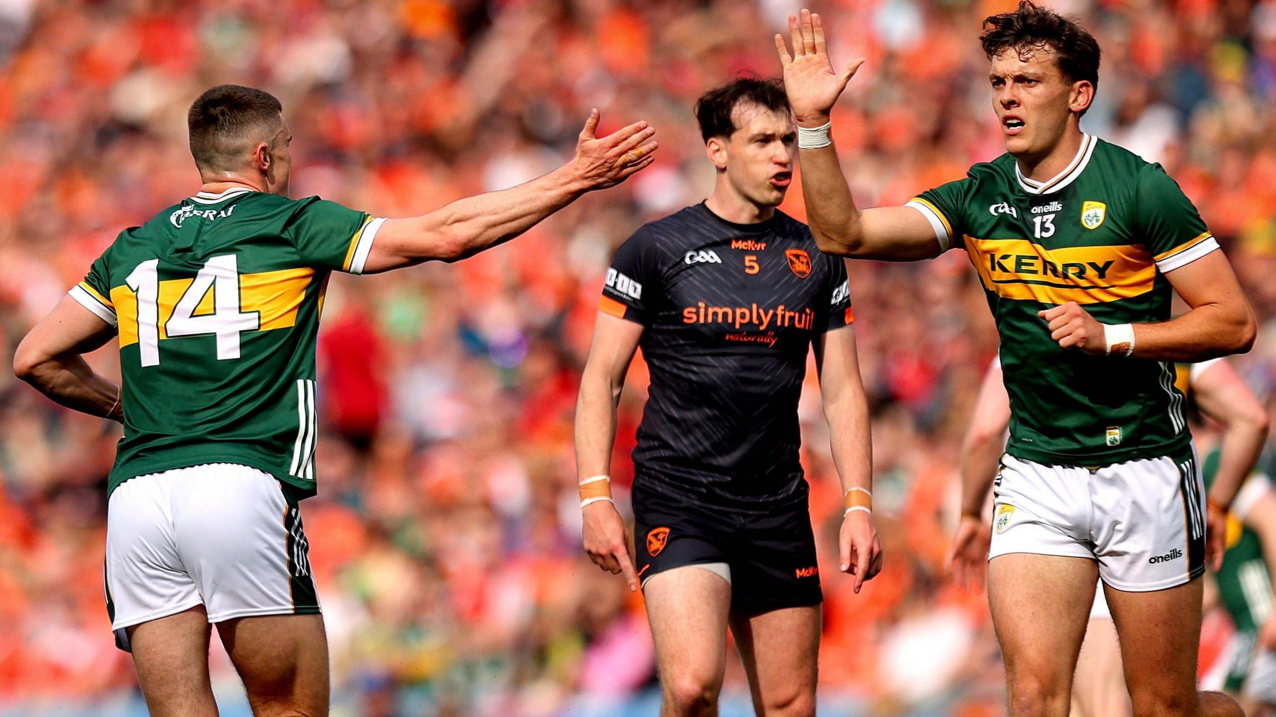 David Clifford (right) celebrates a score with team-mate Sean O'Shea but it was a frustrating afternoon for the Kingdom star as he was shackled by Armagh goalscorer Barry McCambridge