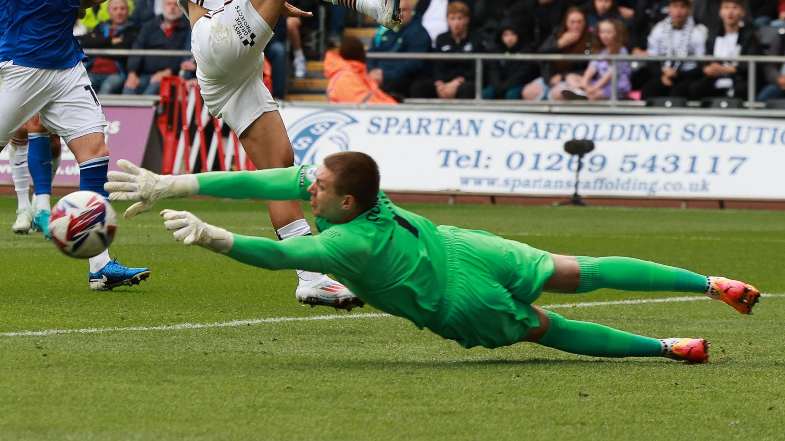 Cardiff City goalkeeper Ethan Horvath dives