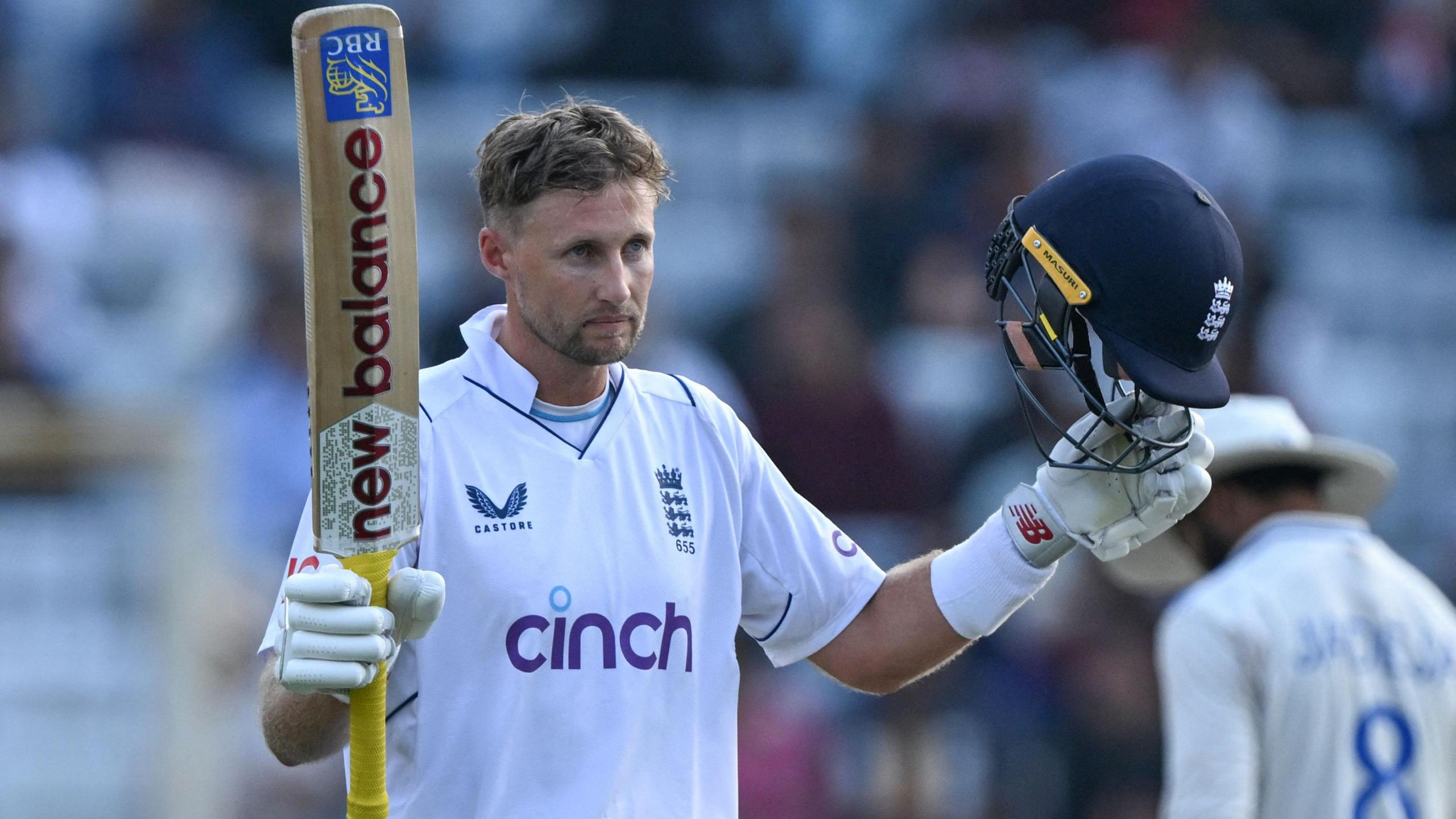 England's Joe Root celebrates hitting a century against India