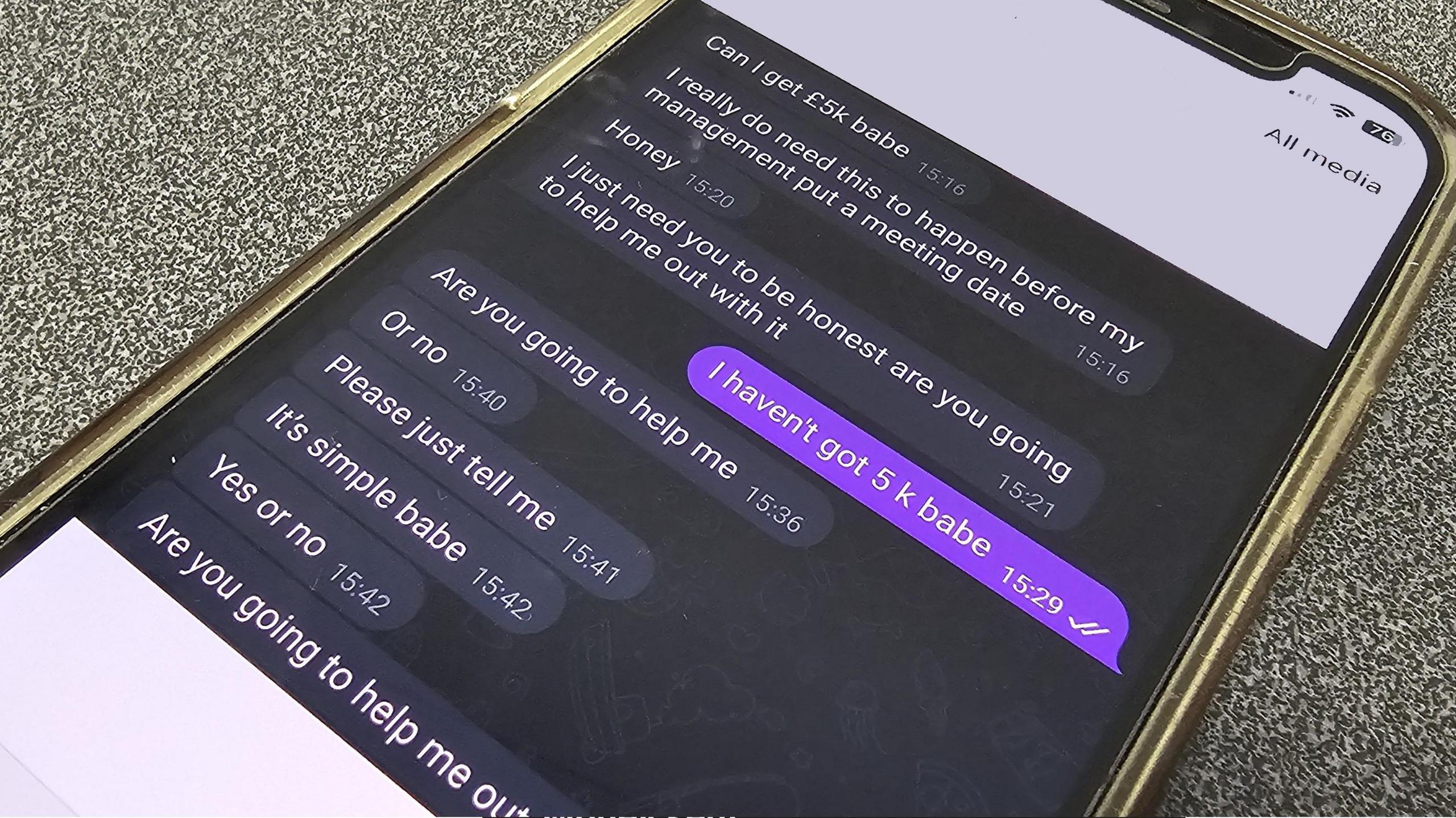 A mobile phone with a text chat on the screen. There are multiple messages from the scammer asking for money and pushing Mary to say she will help