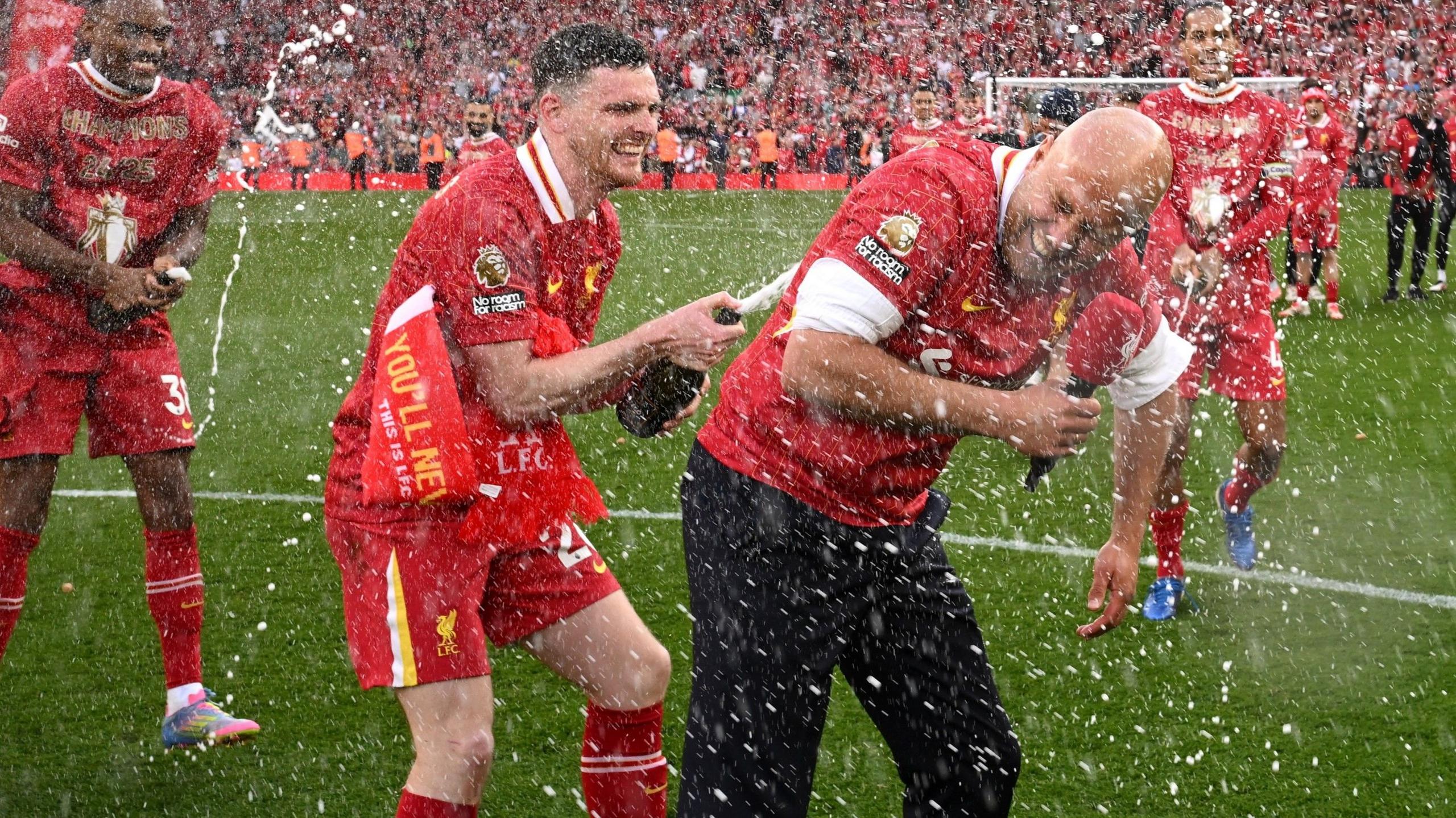 Liverpool's Andy Robertson and Arne Slot celebrate