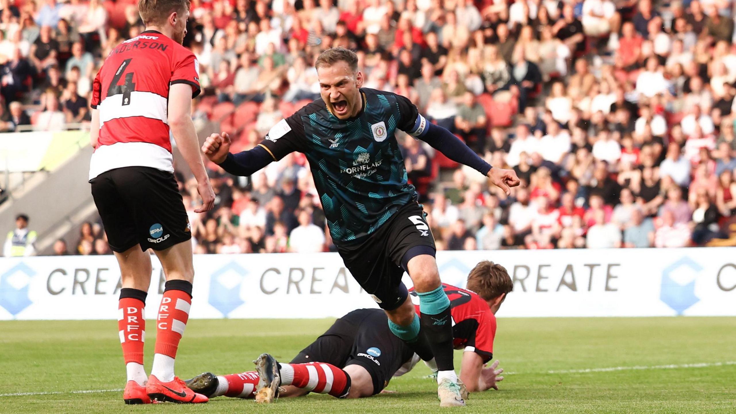 Mickey Demetriou celebrates scoring a crucial goal against Doncaster for Crewe