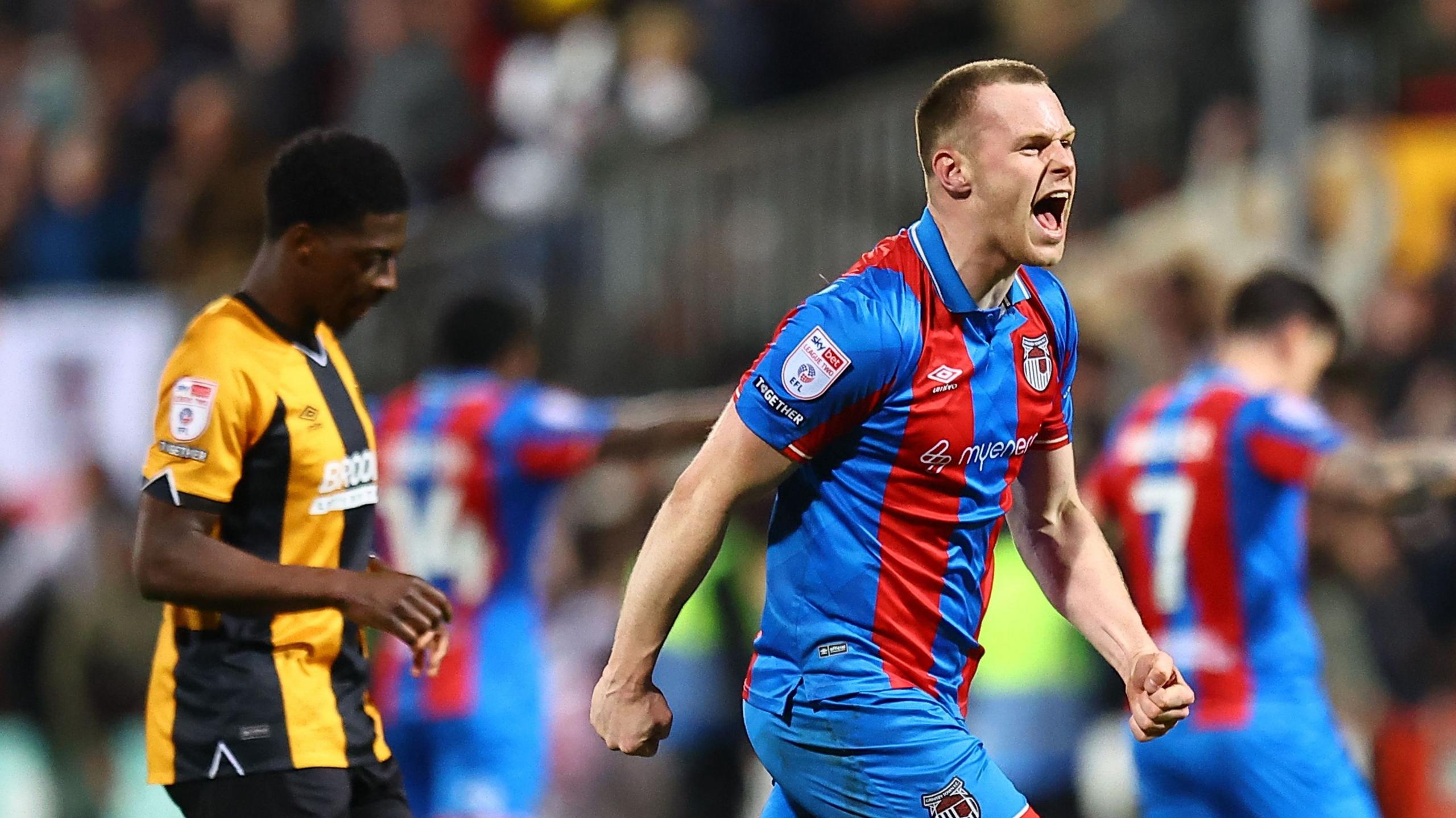 Cameron McJannet, of Grimsby Town, celebrates his late winner against Cambridge United
