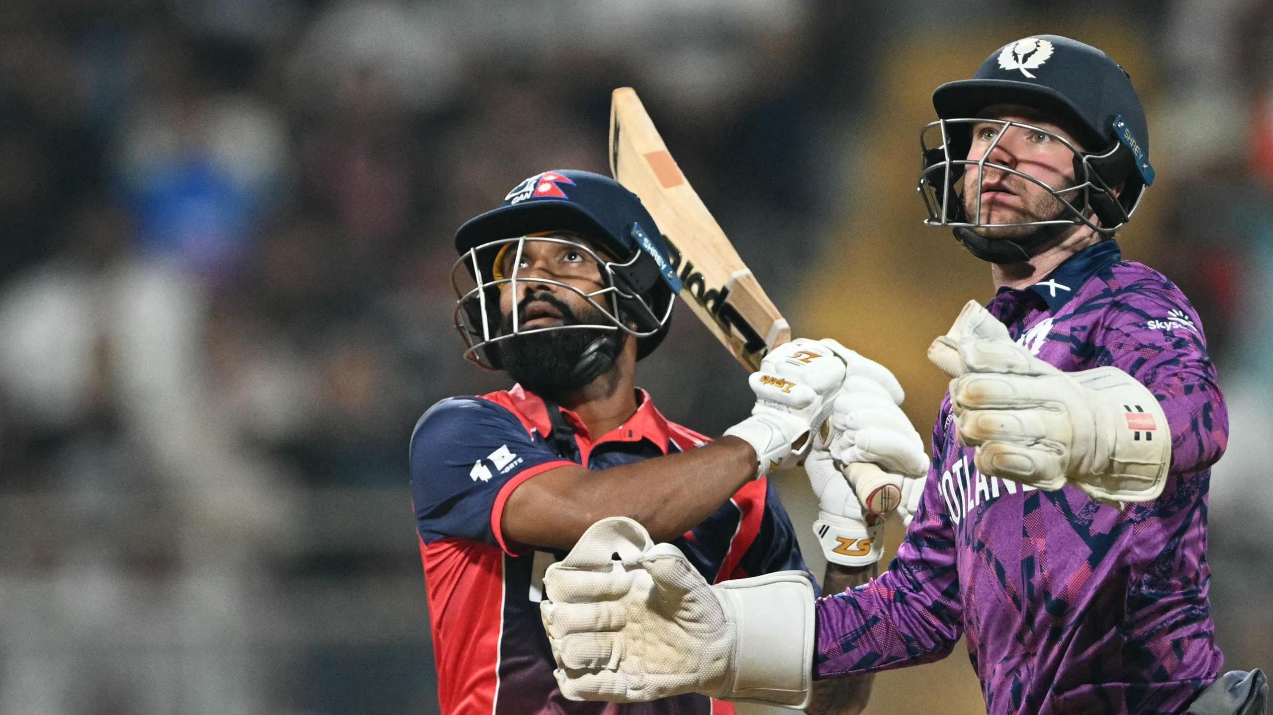 Nepal batter Dipendra Singh Airee and Scotland wicketkeeper Matthew Cross during a T20 World Cup match earlier in 2026