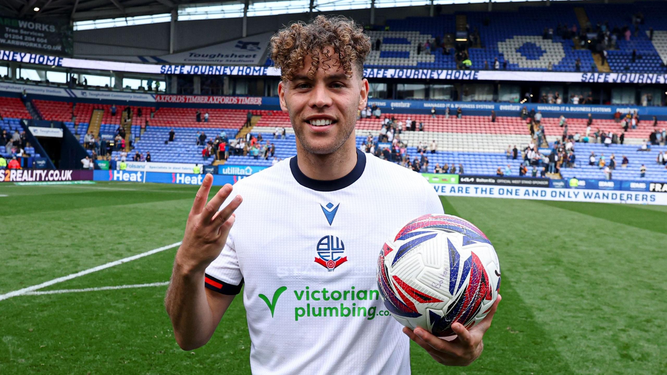 Bolton's Dion Charles with the match ball after scoring a hat-trick against Reading