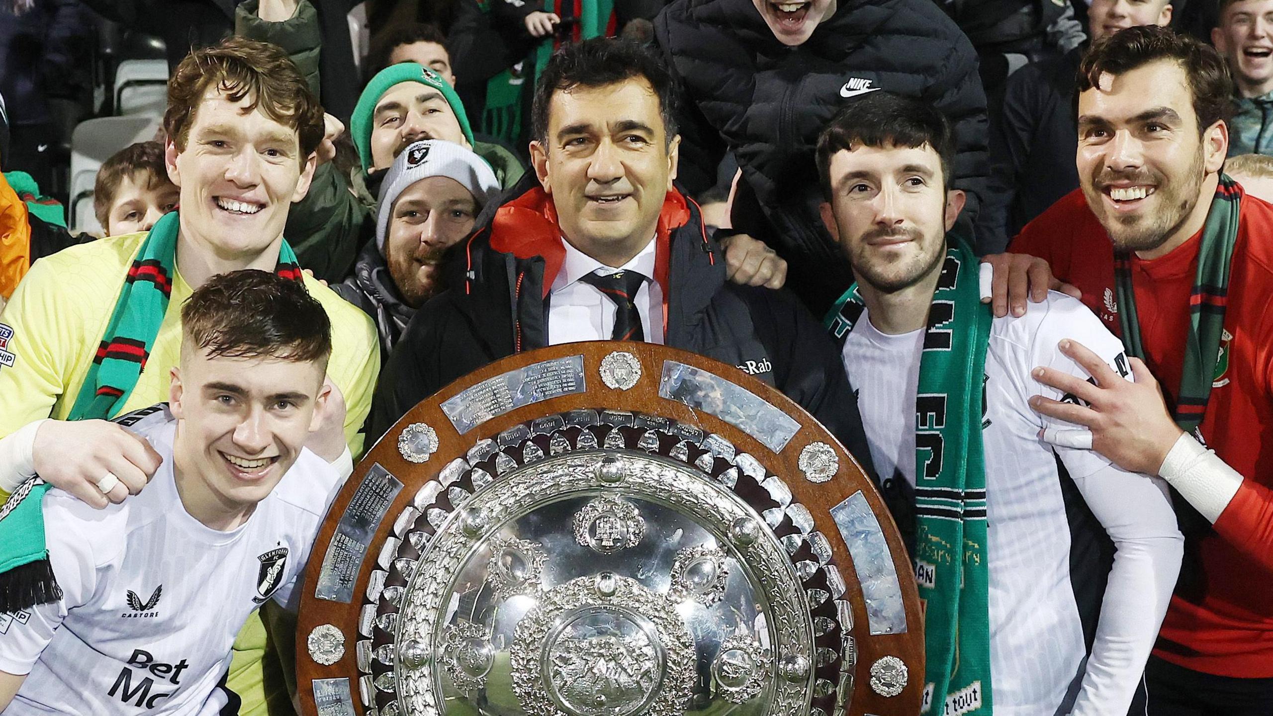 Ali Pour (centre) celebrates Glentoran's County Antrim Shield victory last season
