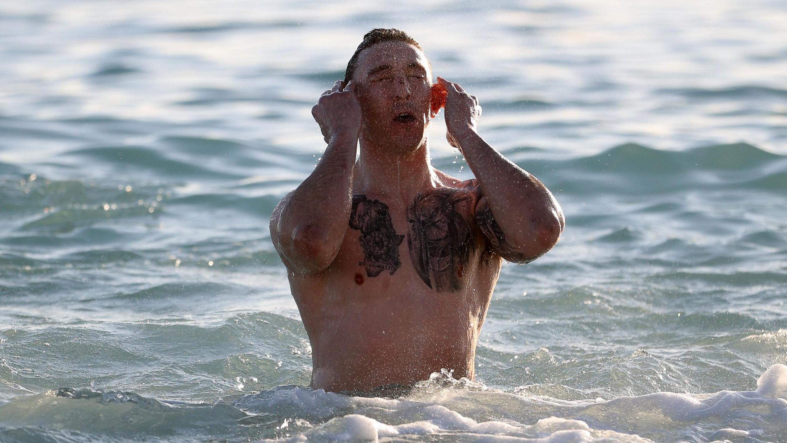 Josh Adams in the sea