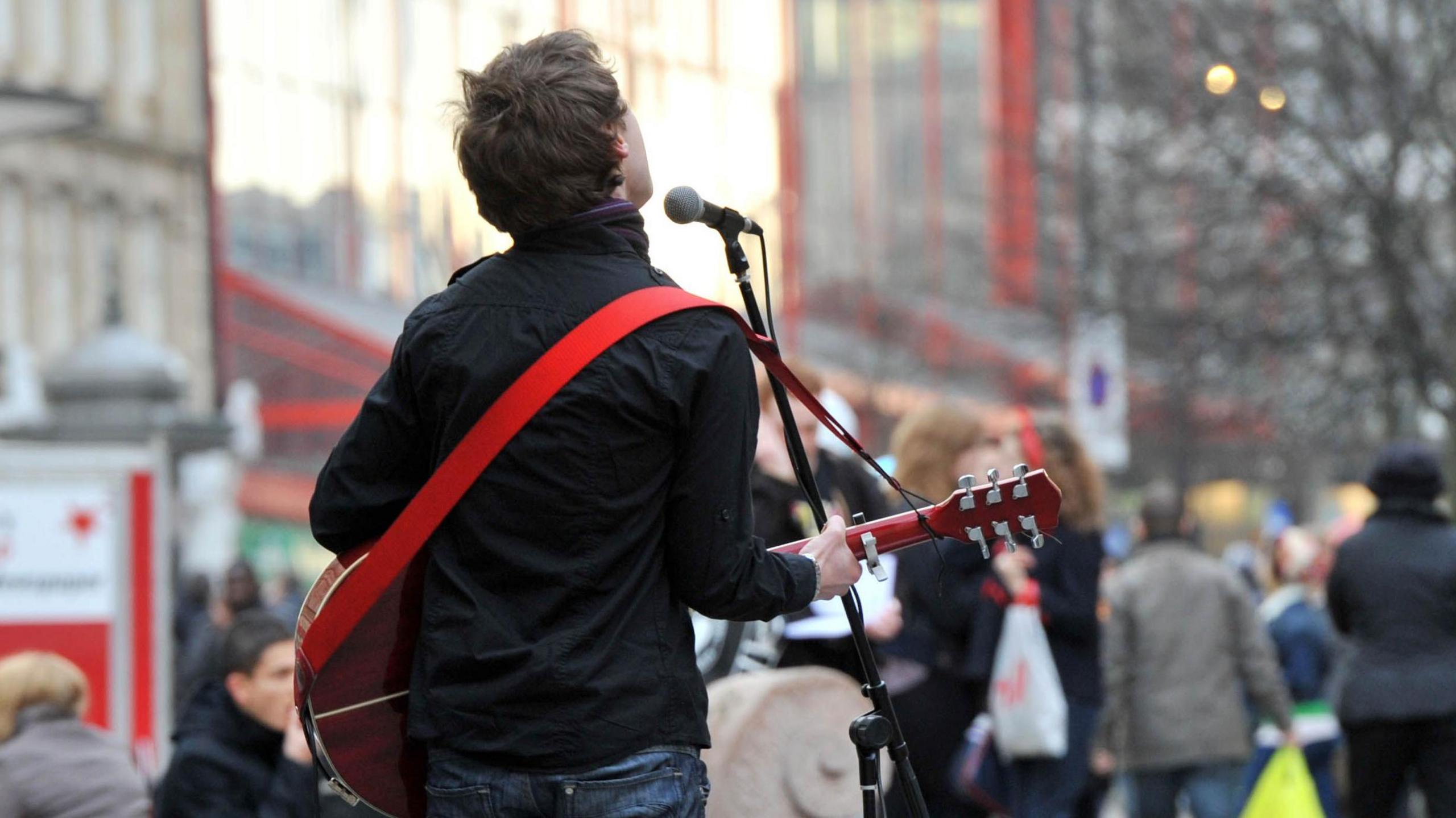 Busker singing in street