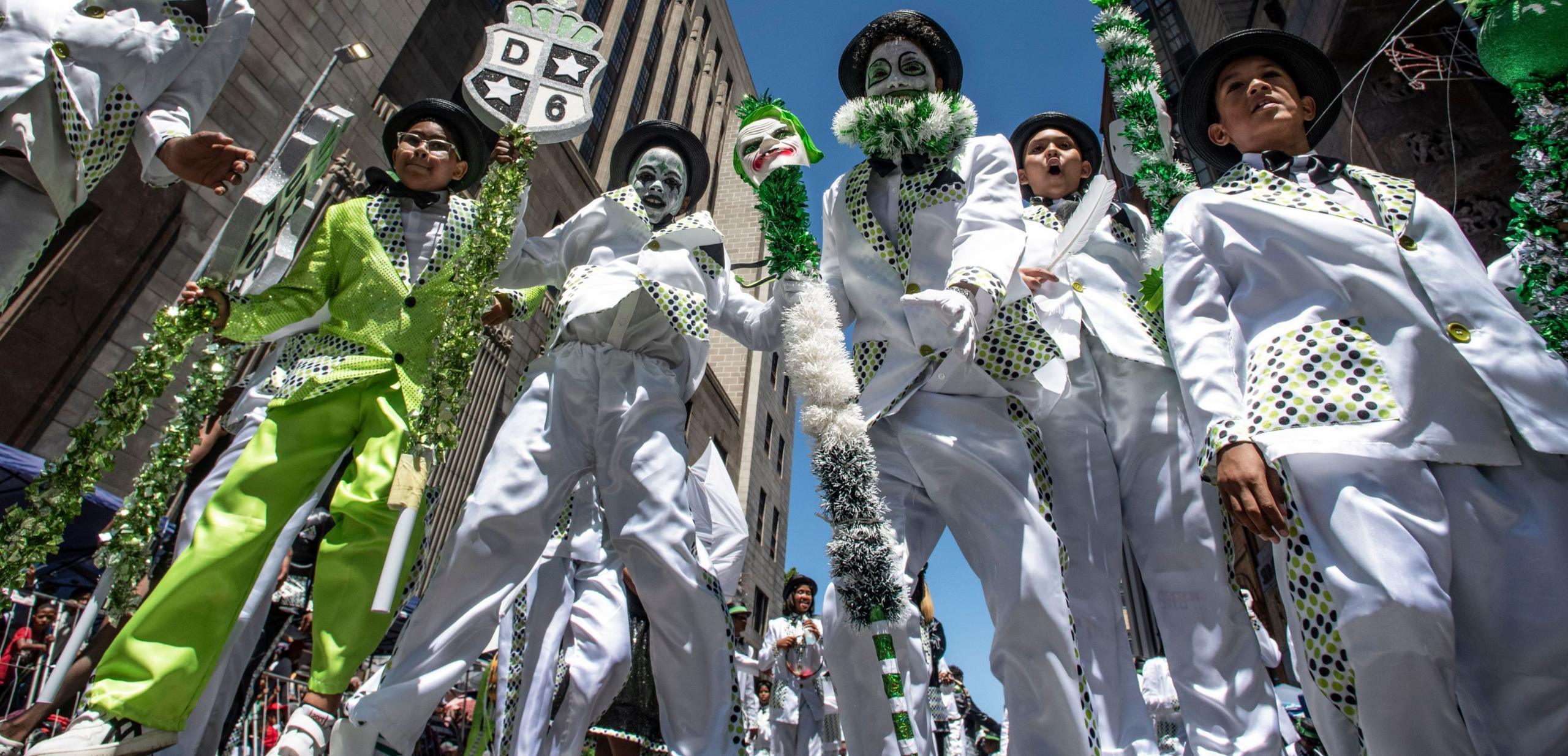 A group of five people wearing white and green suits participate in the Tweede Nuwe Jaar festival - Saturday 4 January 2025