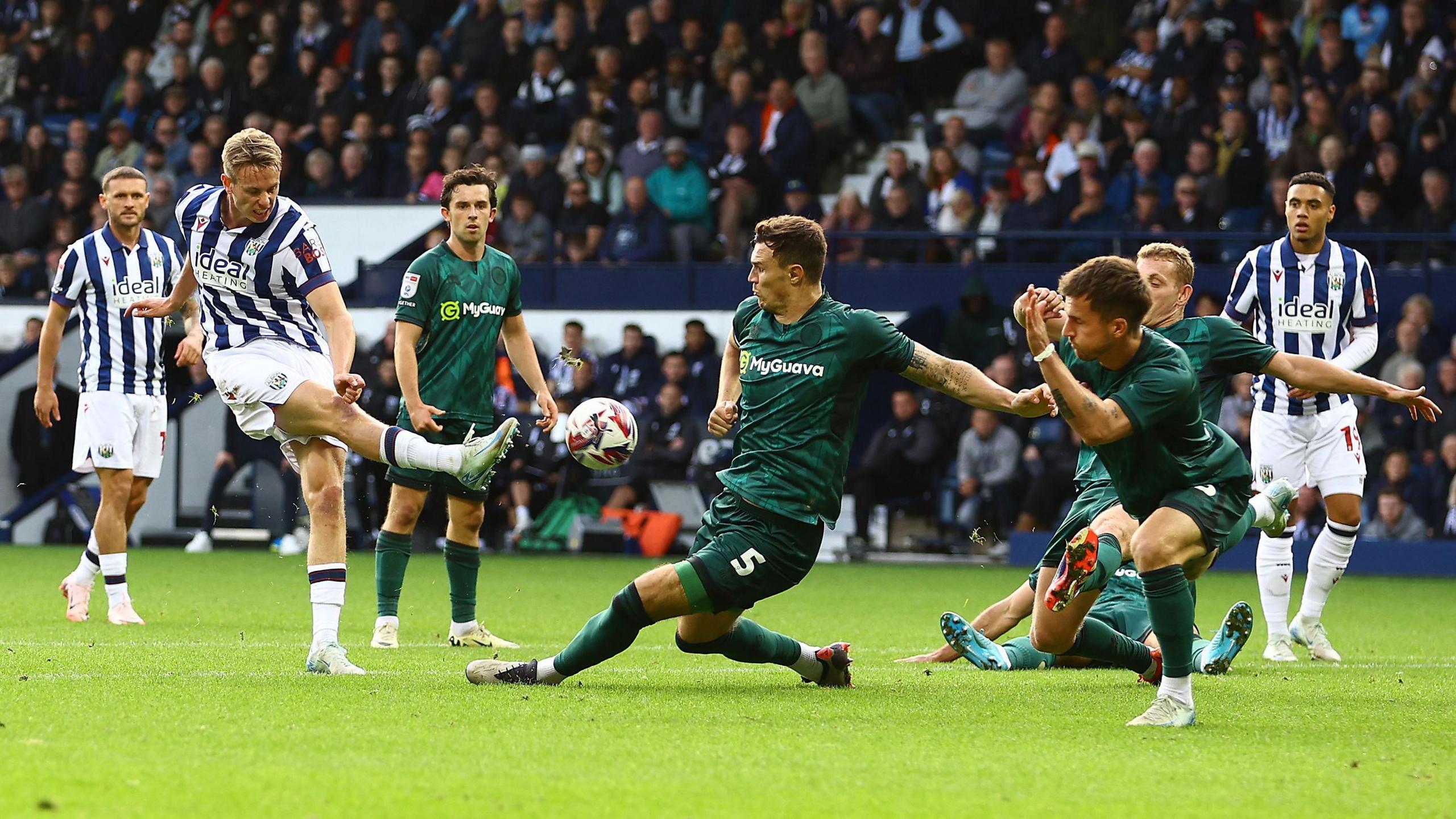 Jake Cooper of Millwall blocks the shot of Torbjørn Heggem of West Bromwich Albion