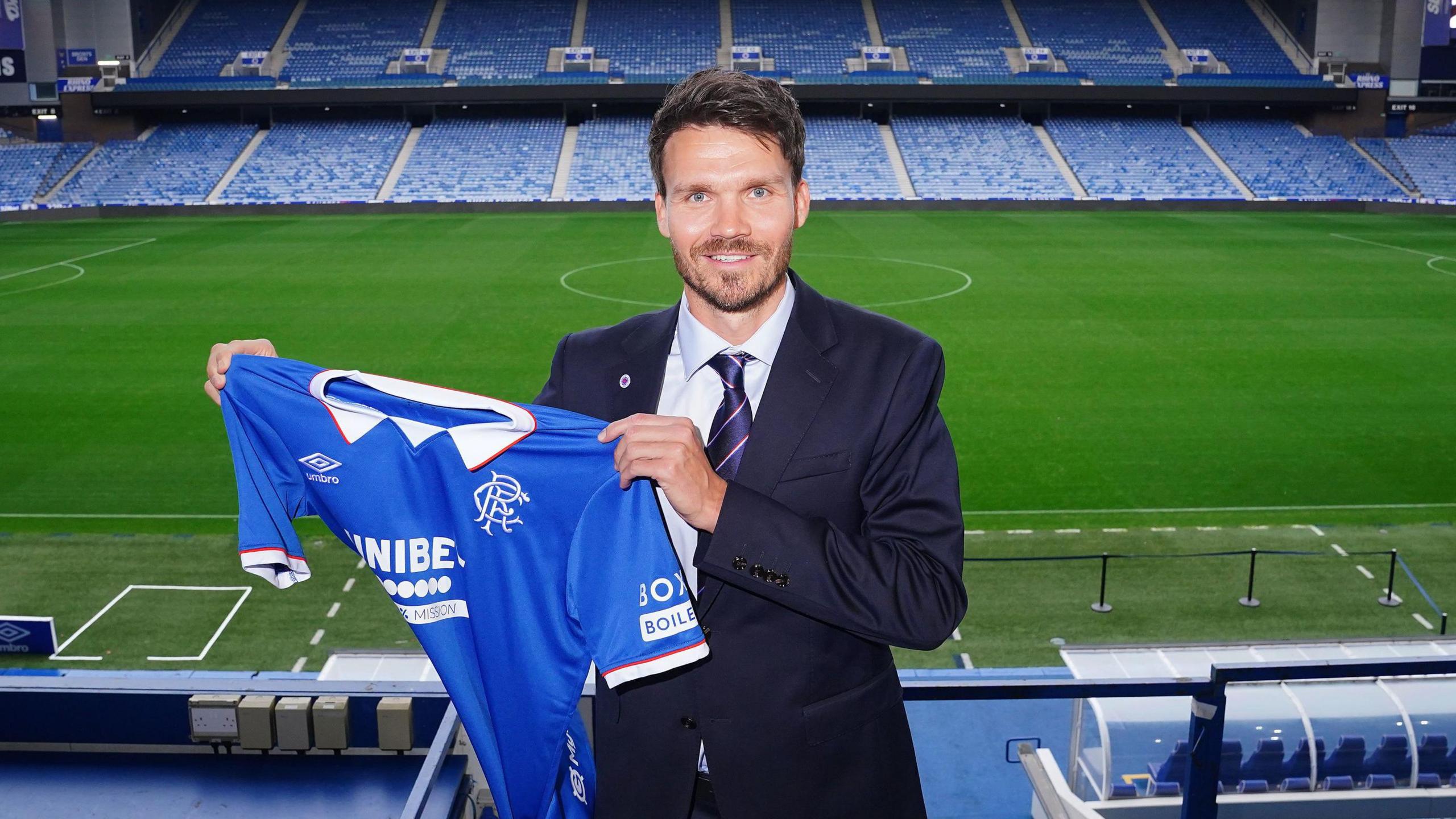 Danny Rohl poses for photographs at Ibrox