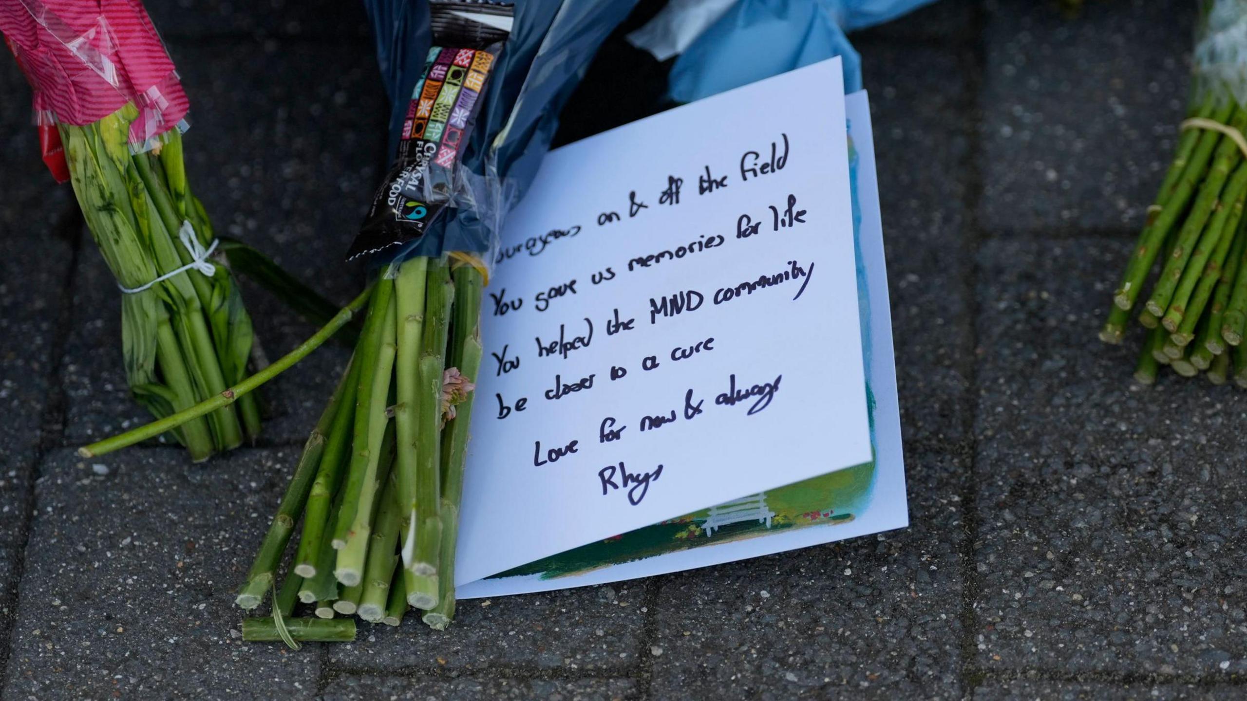 flowers with handwritten tribute 