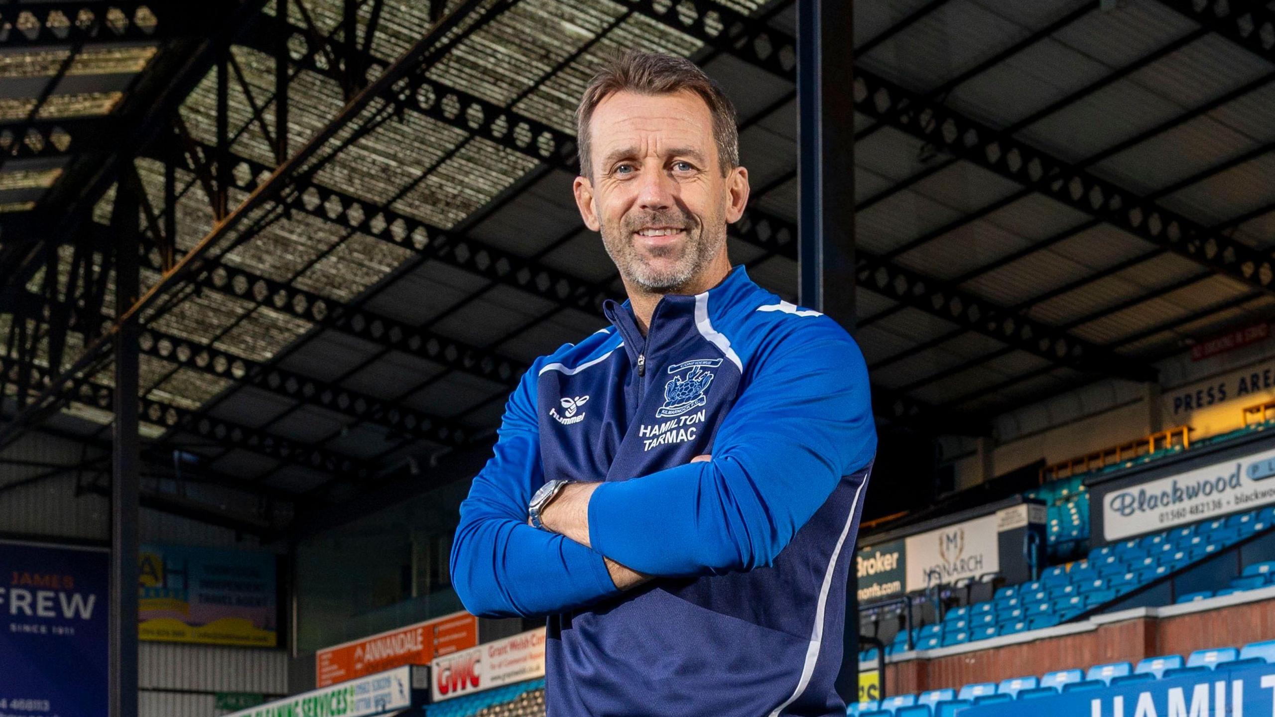 Neil McCann poses for photos at Rugby Park