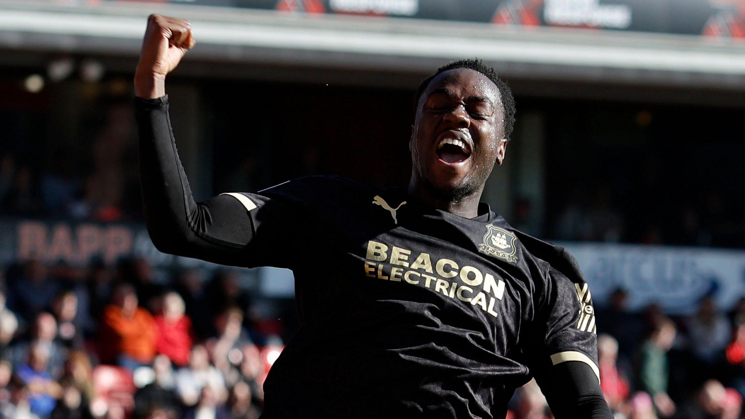 Owen Oseni celebrates scoring