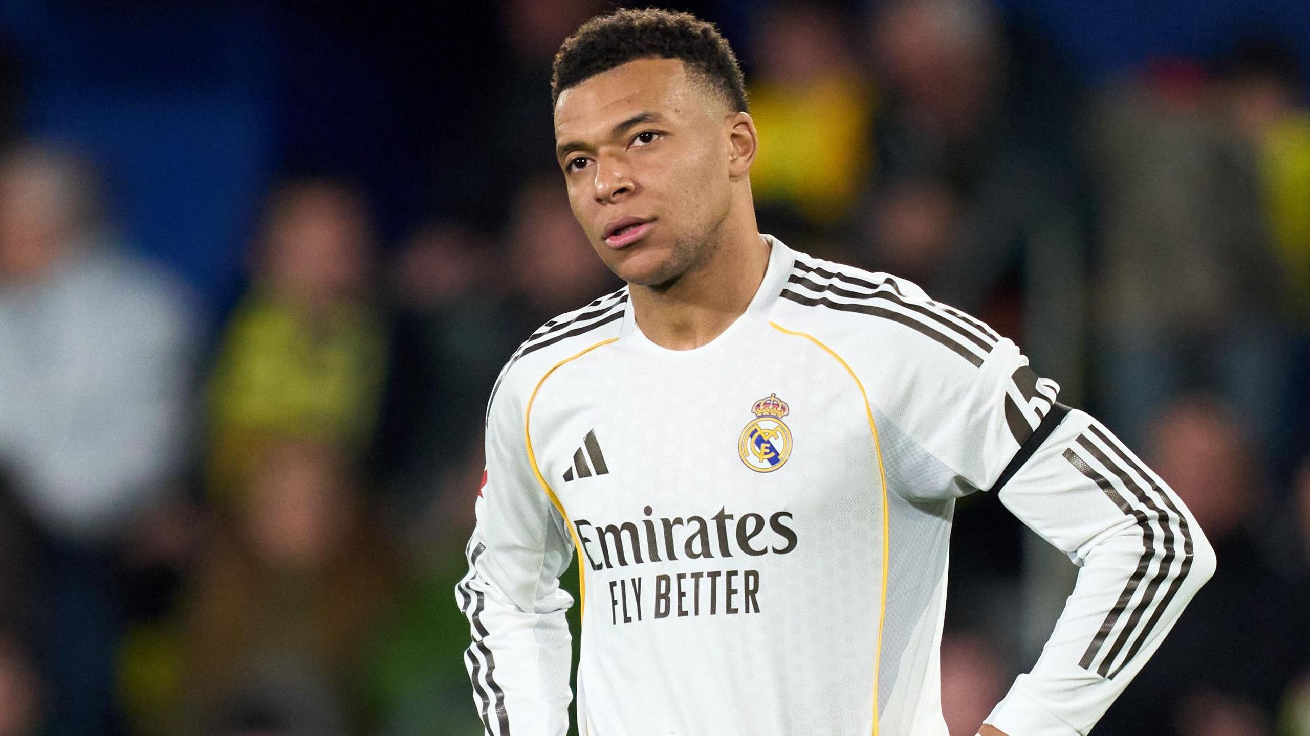Real Madrid striker Kylian Mbappe with his hands on his hips during a La Liga game