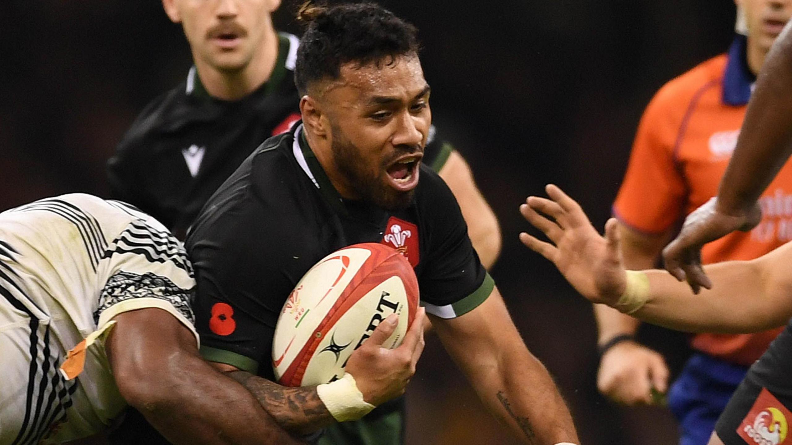 Willis Halaholo of Wales is tackled by Zurile Togiatama of Fiji in a game played in 2021