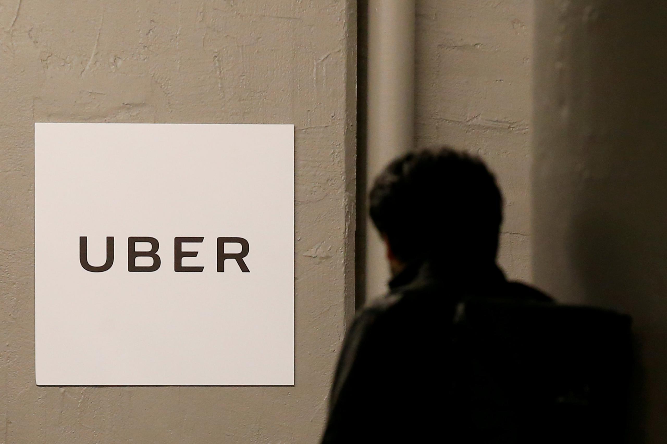 A man arrives at the Uber offices in Queens, New York, US, 2 February 2017