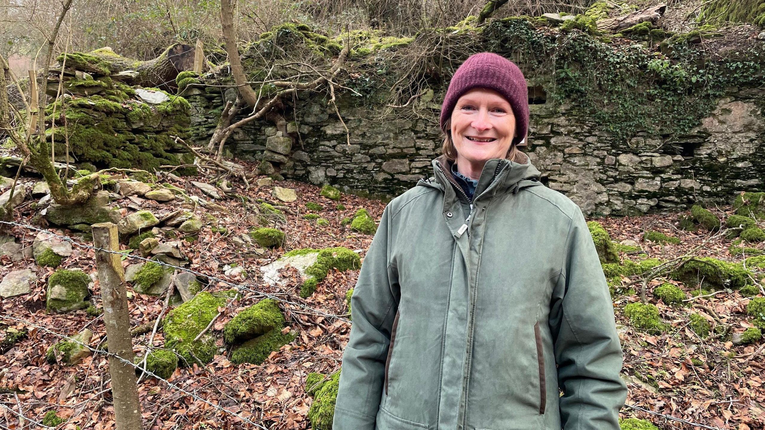 Marion Jeffrey standing in front of the ruins of Beckham Mill in Clicket